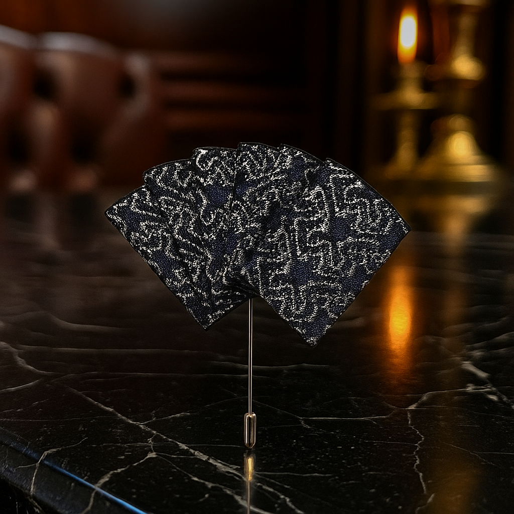 Elegant lapel pin pocket square set in blue with grey edges, showcasing versatility.