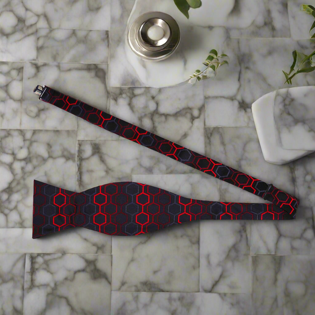 Complete set featuring a matching pocket square with a geometric honeycomb pattern.