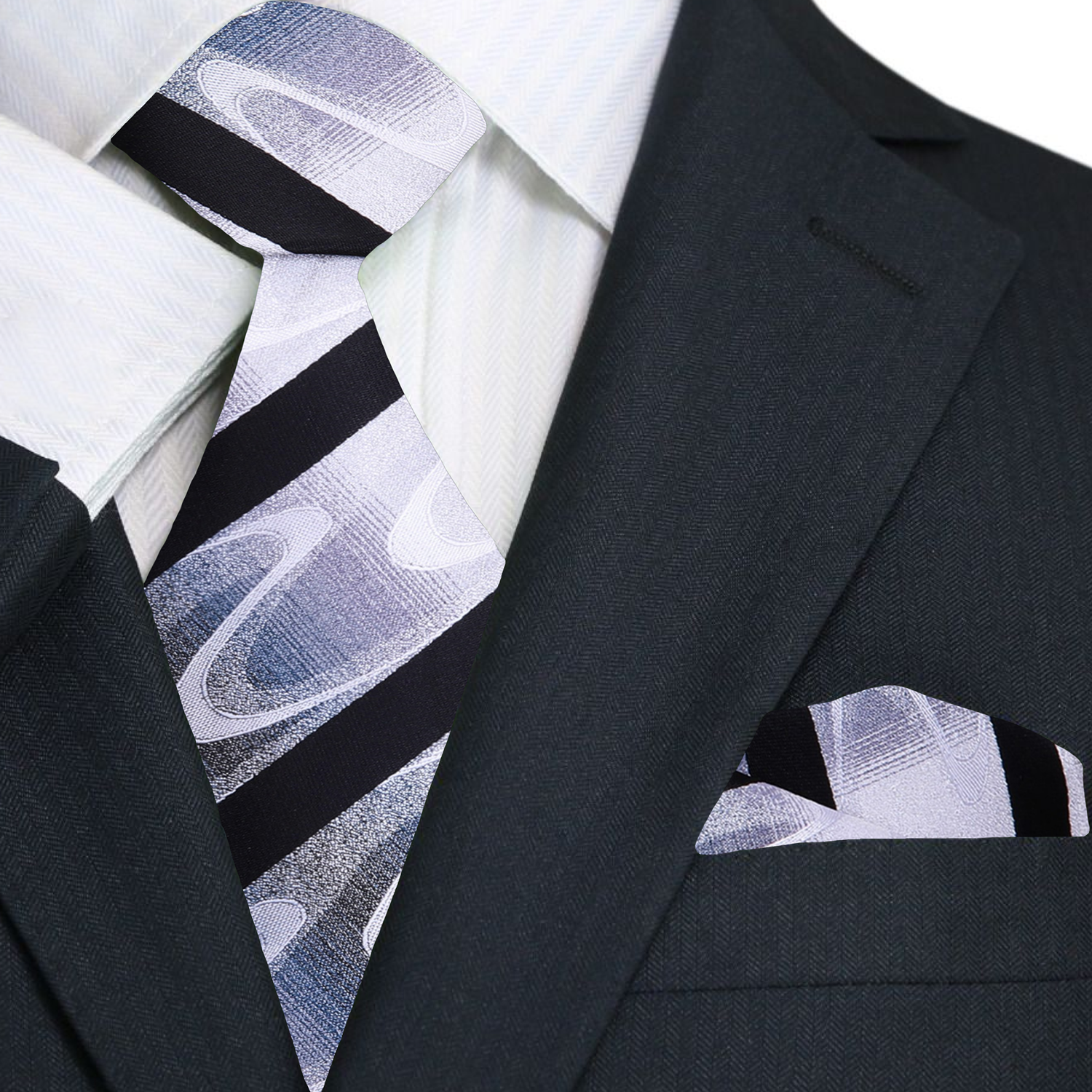 Rothmere striped silk necktie on a grey suit, highlighting the abstract wave pattern.