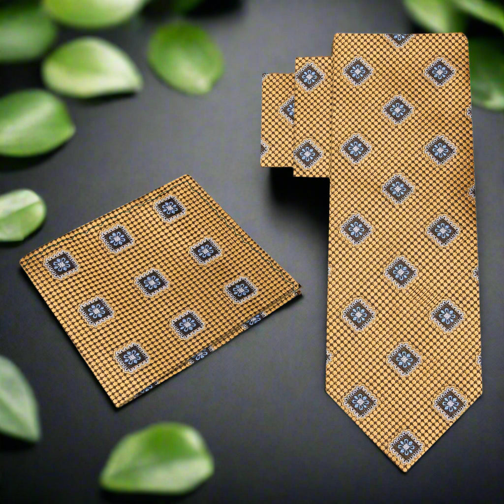 Front view of the Elegant Gold Medallion Necktie featuring geometric patterns in black and blue.