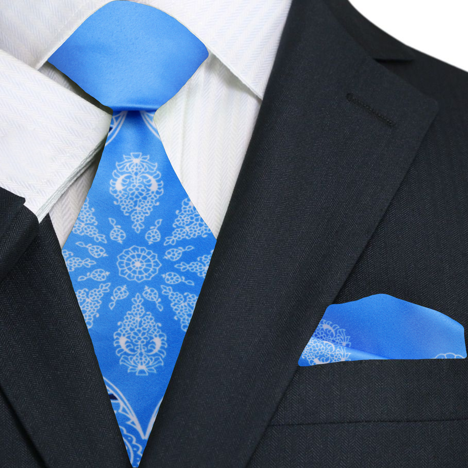 Elegant baby blue paisley silk tie draped over a shirt collar, perfect for weddings