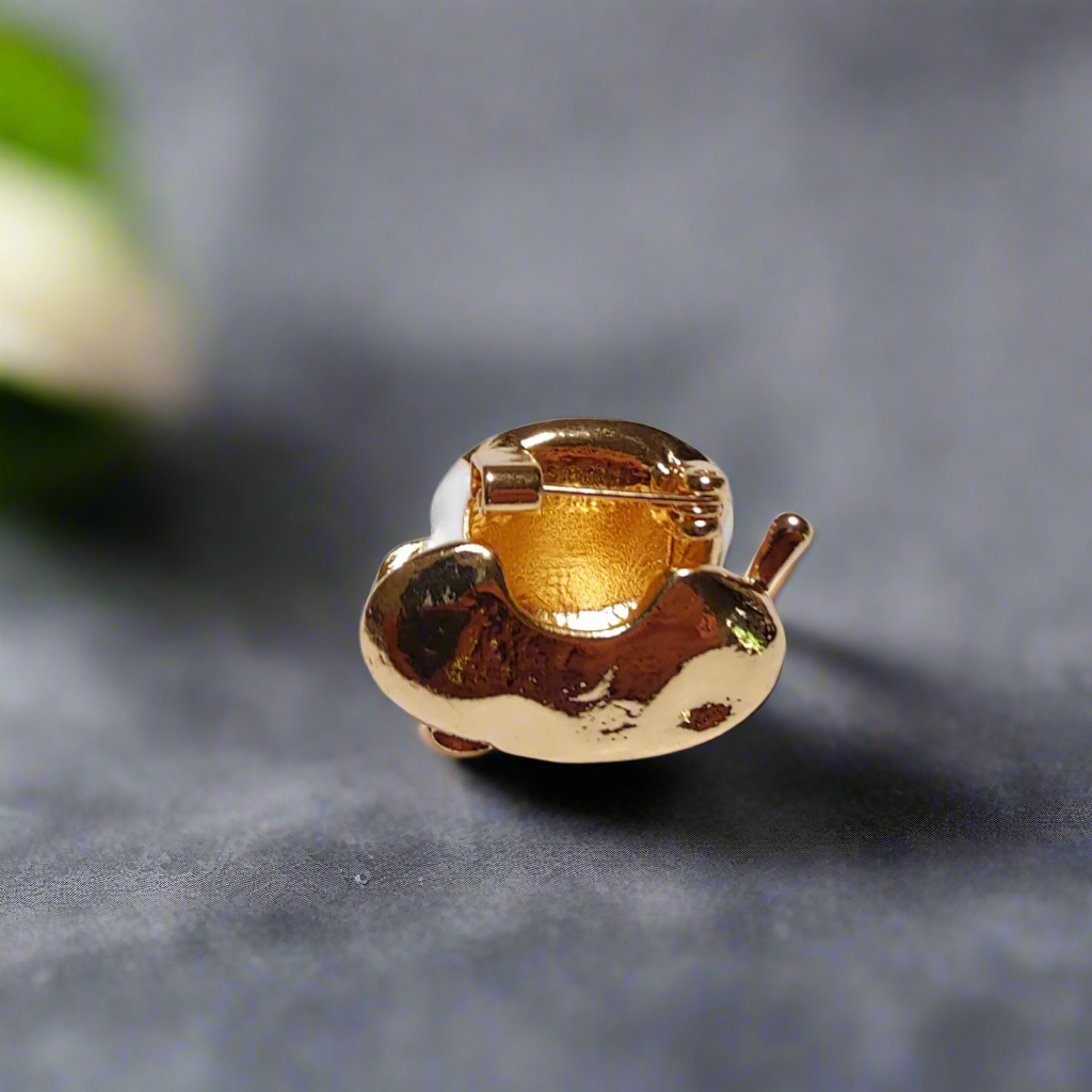 Close-up of a stylish coffee lapel pin worn on a dark suit, perfect for business meetings or coffee events.