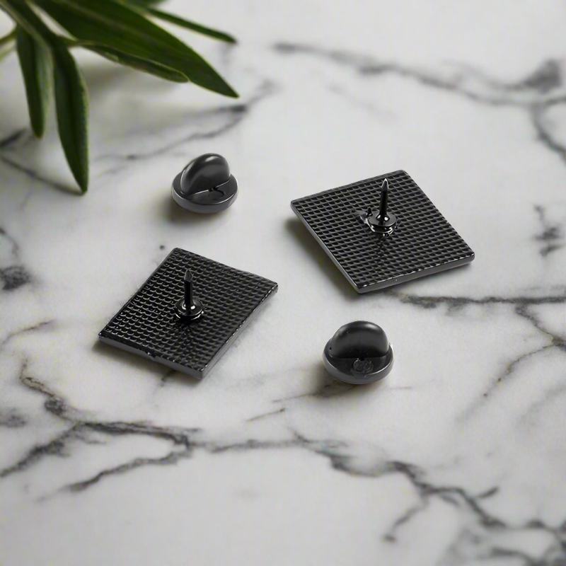 Lapel pin attached to a black suit jacket for a professional look