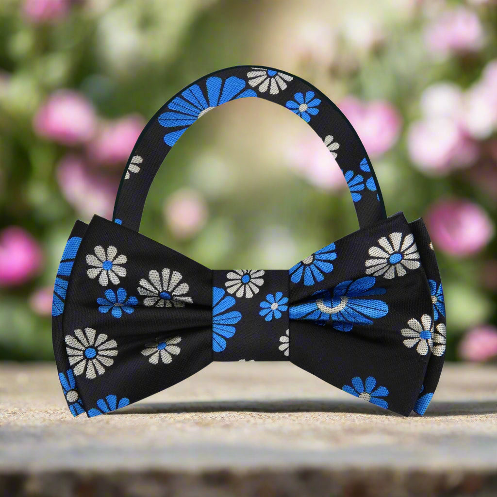 Man wearing a silk bow tie with floral design at a formal dinner