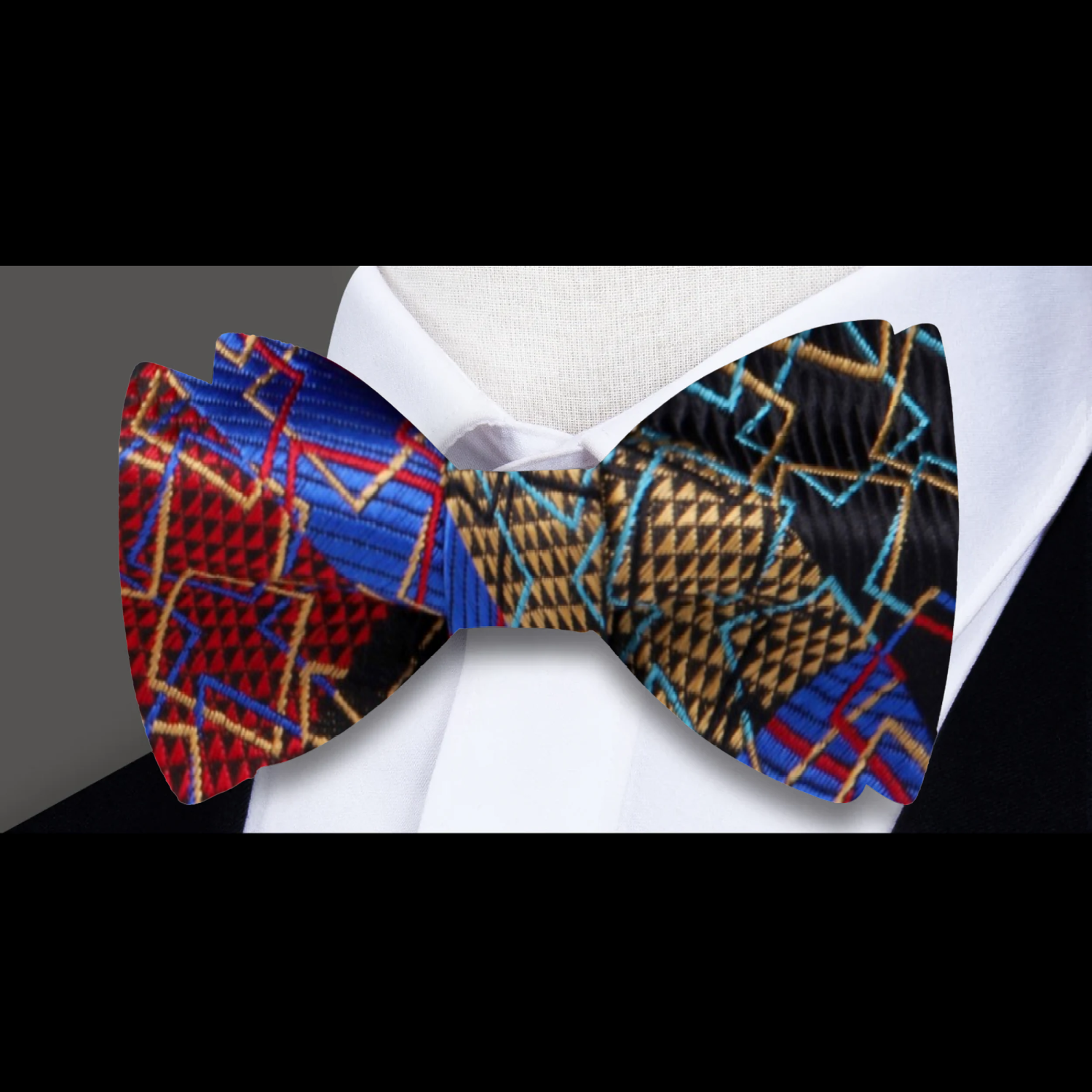 Vibrant geometric silk bow tie displayed on a white background, showcasing its bold colors and pattern.