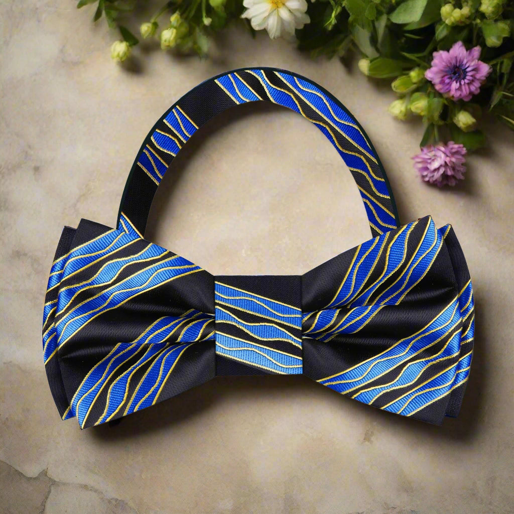 Close-up of a blue silk bow tie with wavy design, perfect for weddings