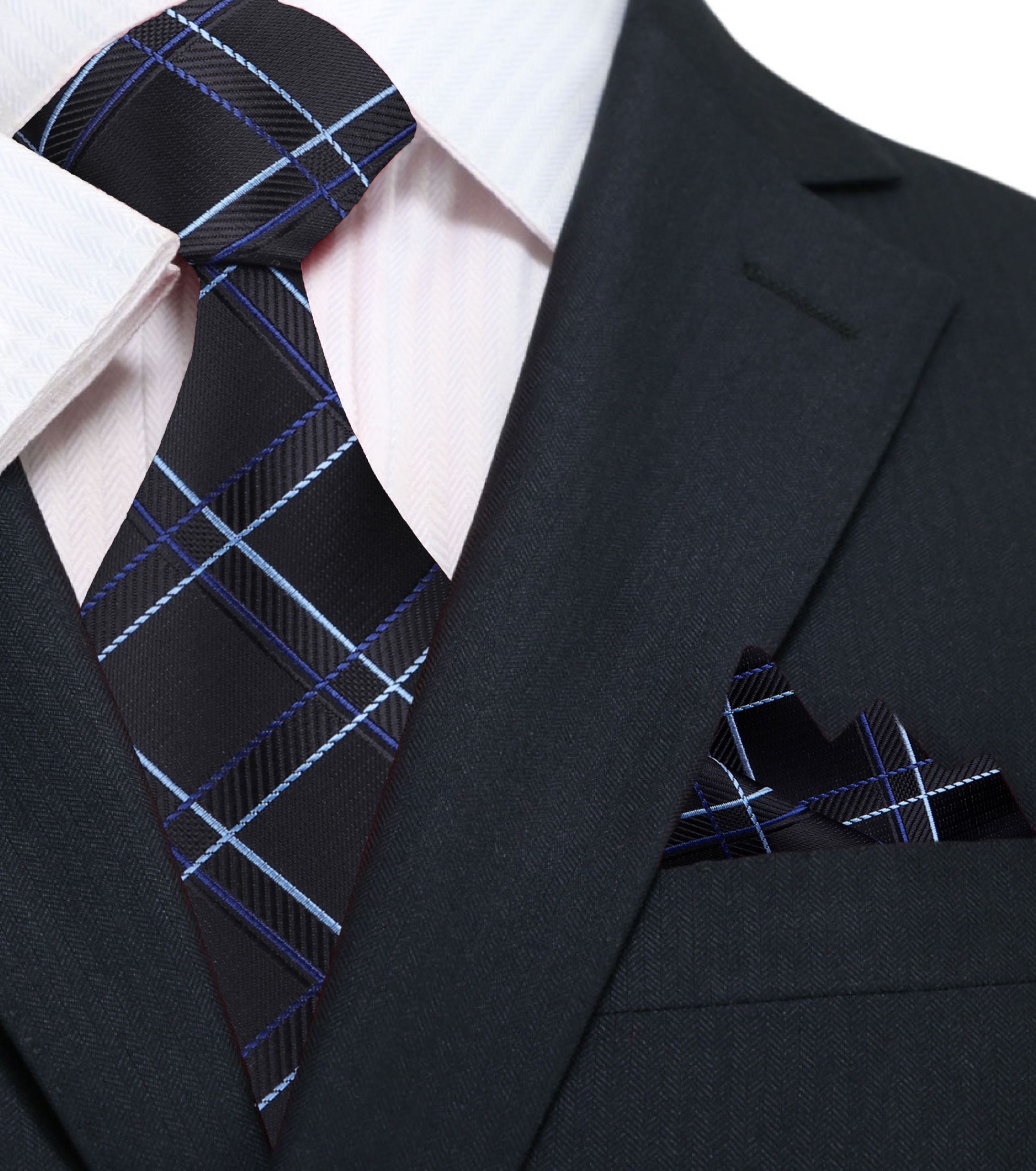 Grey and black plaid tie paired with a crisp white shirt and dark grey blazer