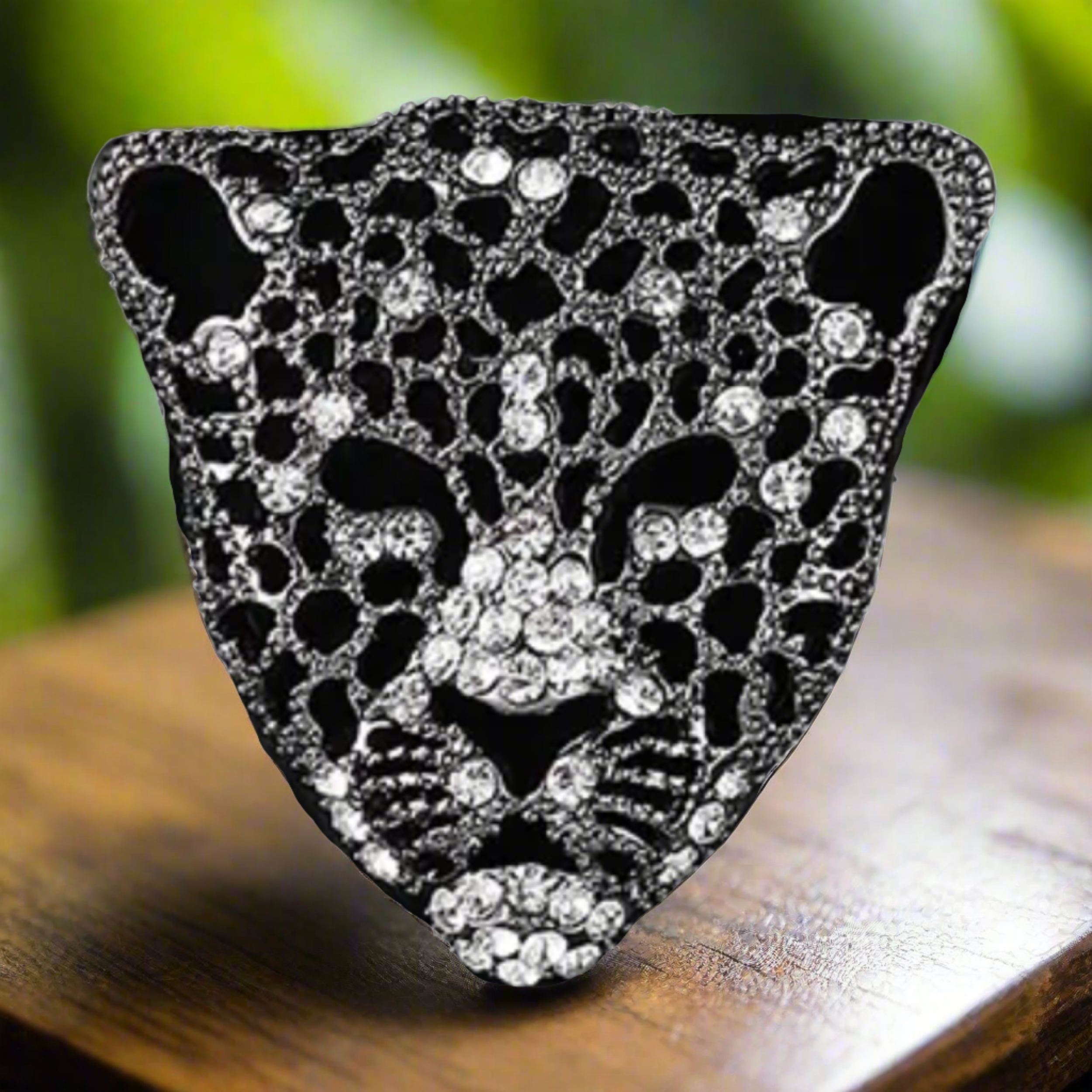 Styled image of a gemstone animal lapel pin attached to a blazer, highlighting its luxurious appearance
