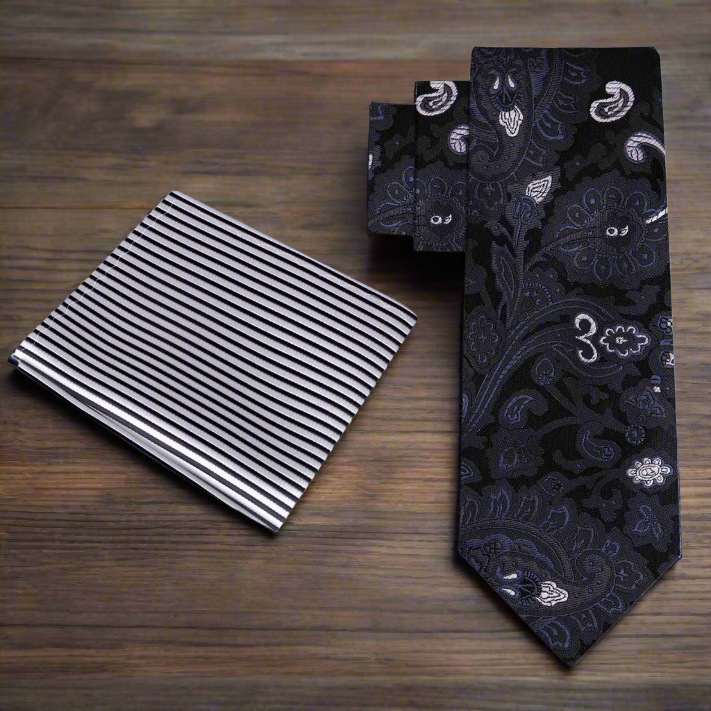 Matching silk pocket square with paisley pattern alongside formal black suit