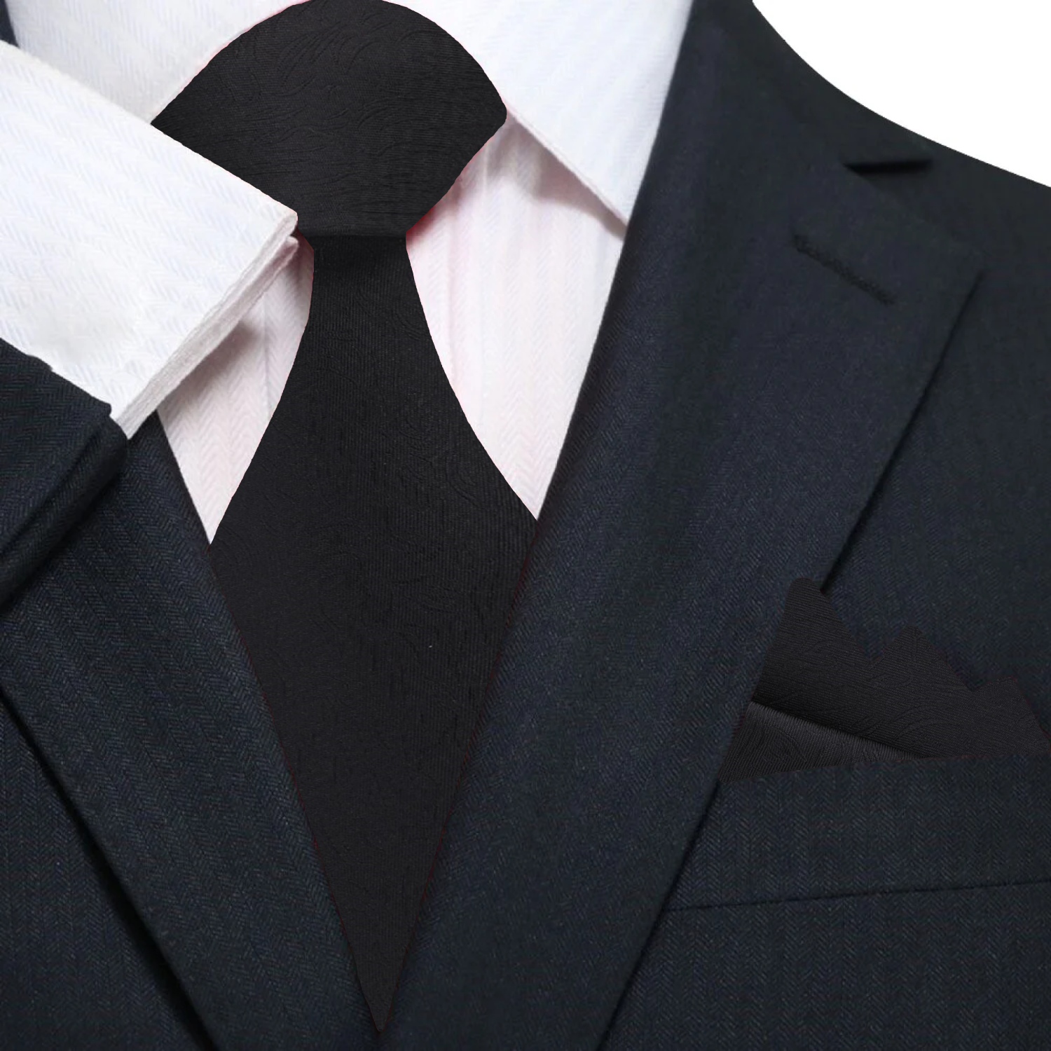 Model wearing the black necktie with a charcoal suit at a wedding.
