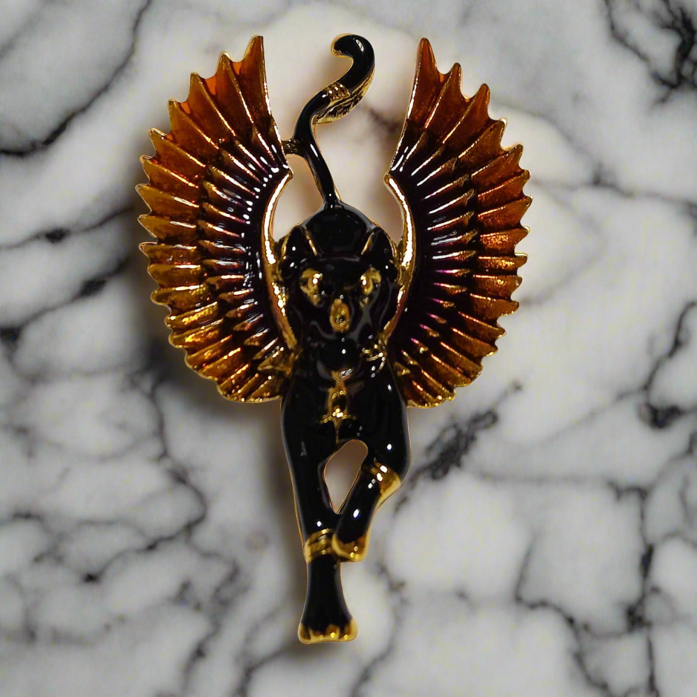 Elegant Bastet lapel pin in white against a dark suit, showcasing its contrast and style.