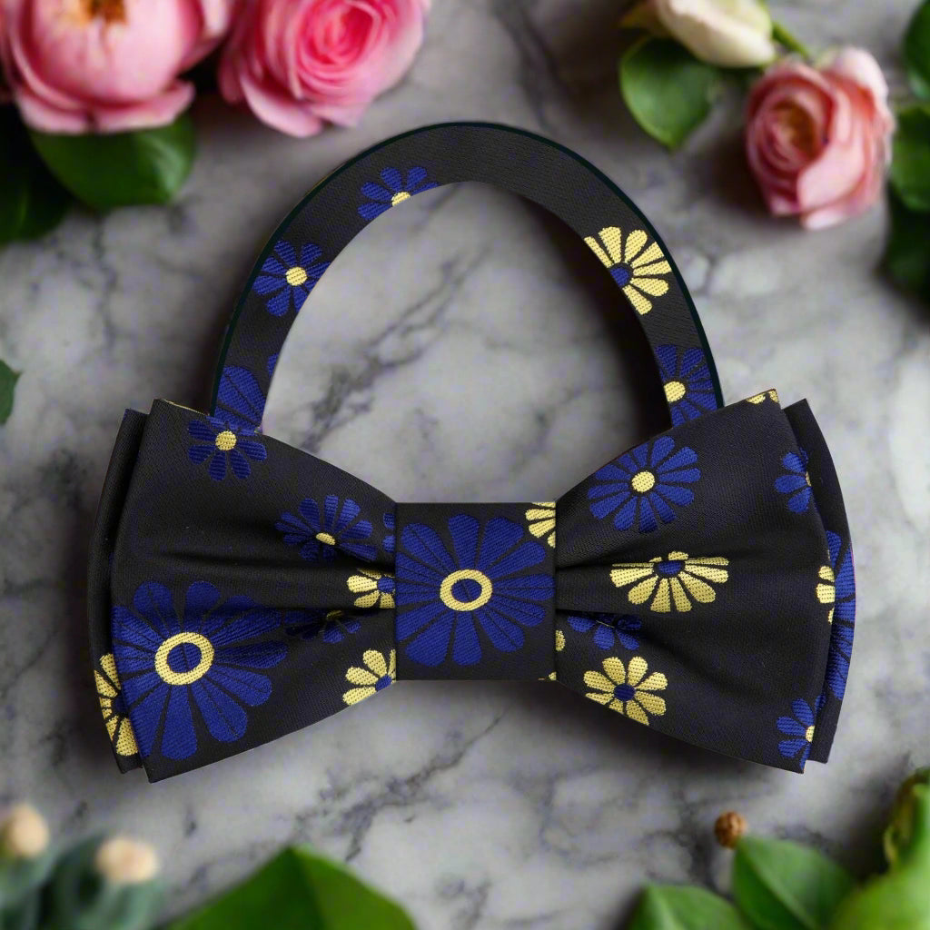 Man wearing a silk bow tie with floral design at a formal dinner
