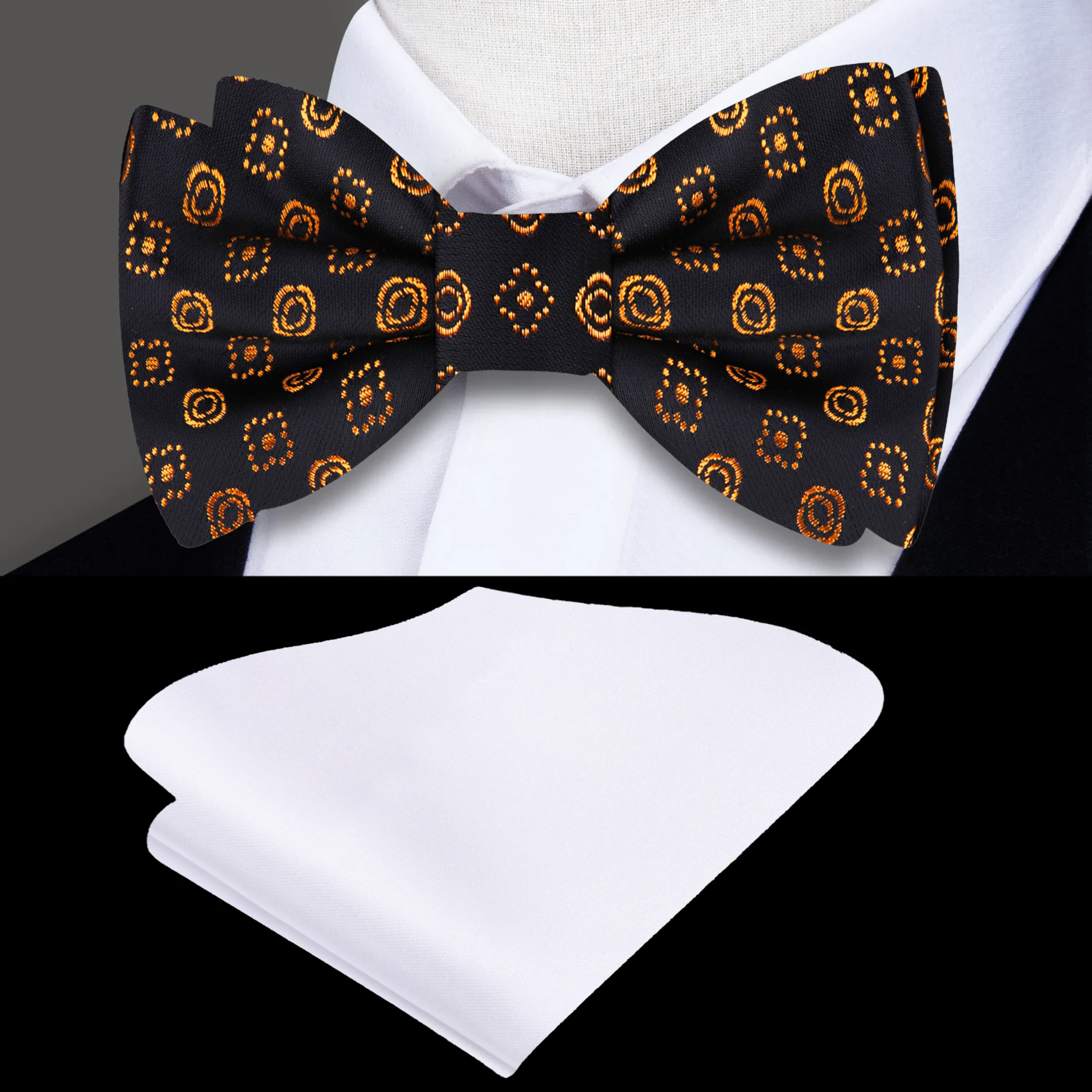 Elegant black silk bow tie with gold geometric accents on a white background.
