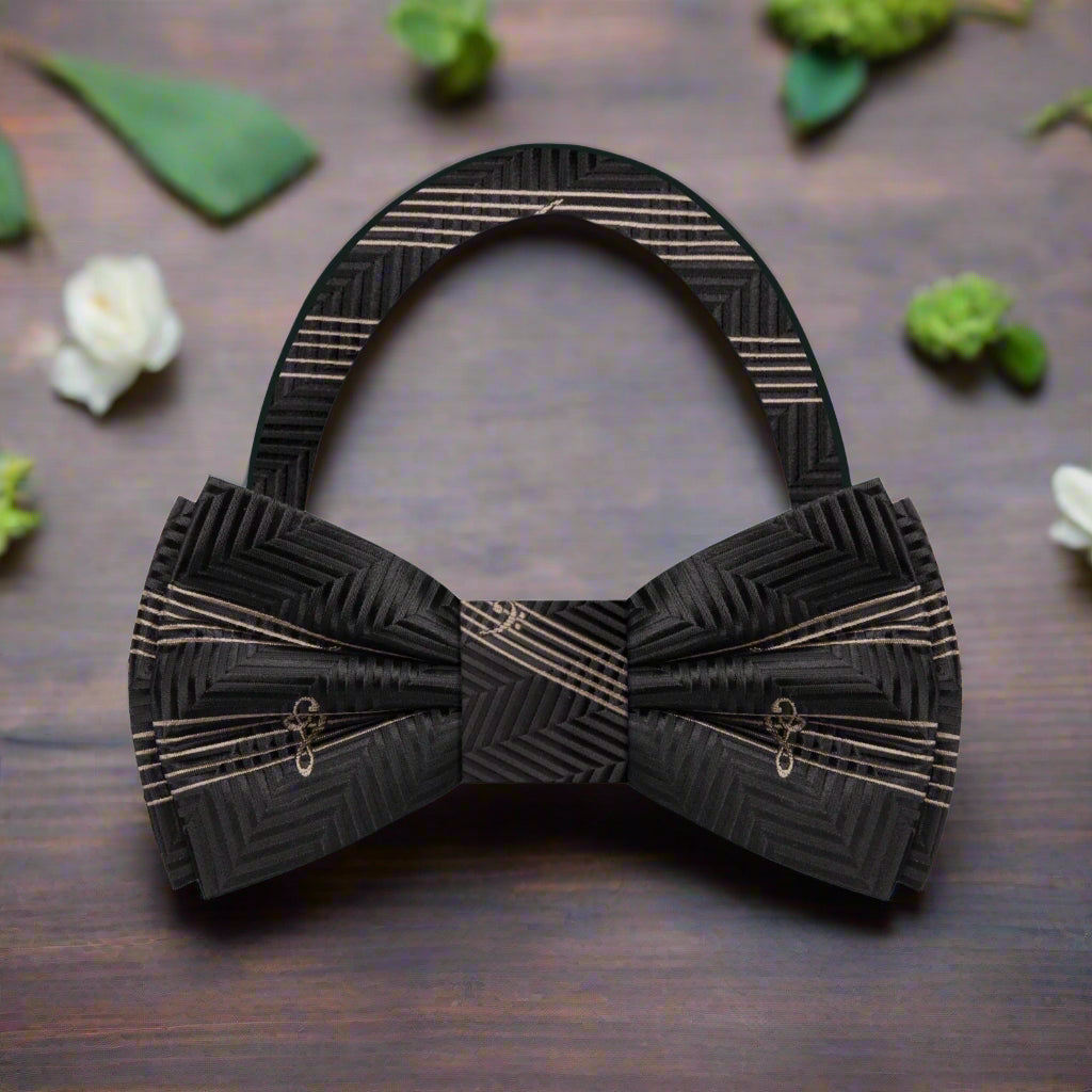 Close-up of a silk music-themed bow tie with sheet music pattern, ideal for concerts
