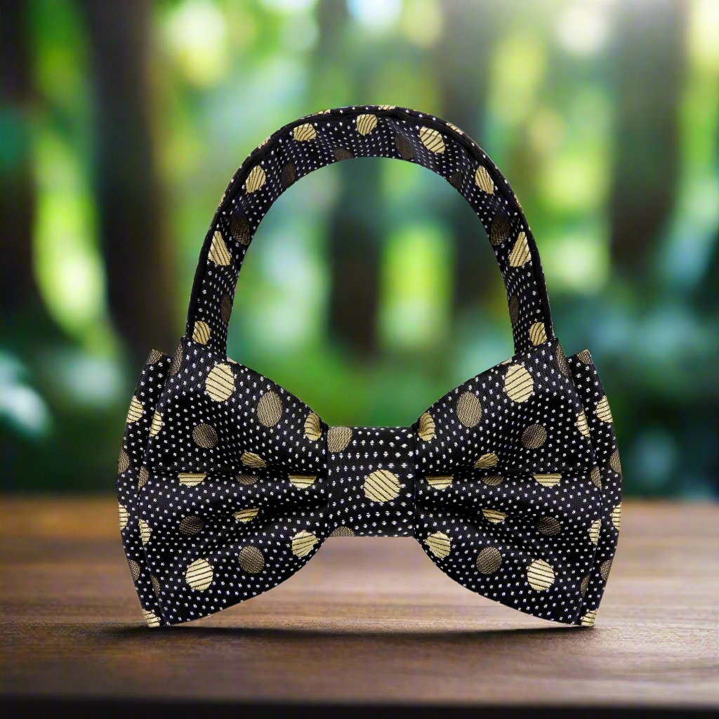 Elegant gold polka dot bow tie displayed on a formal shirt, showcasing its luxurious silk texture.