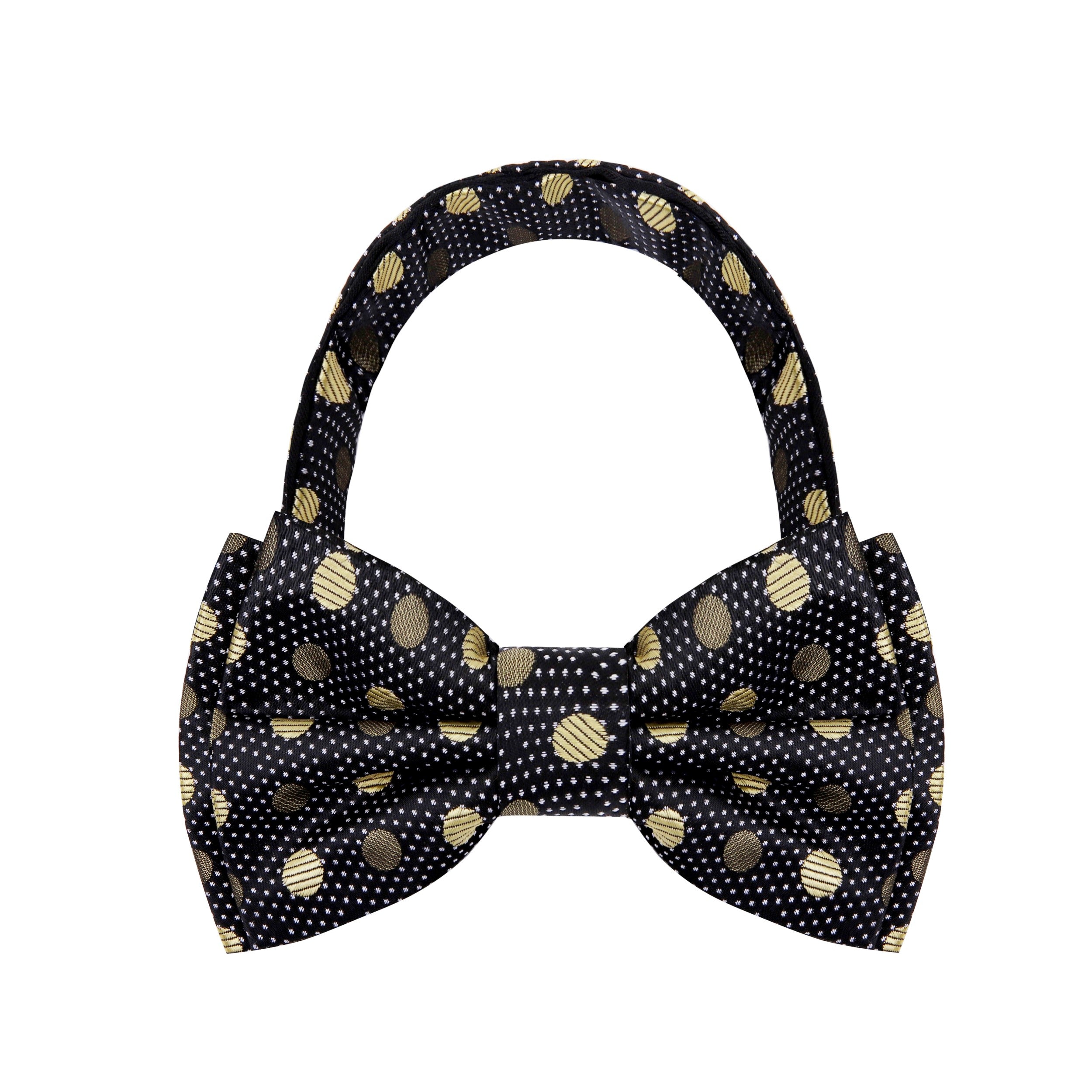 Child wearing the charming polka dot bow tie at a formal event, complementing their outfit.