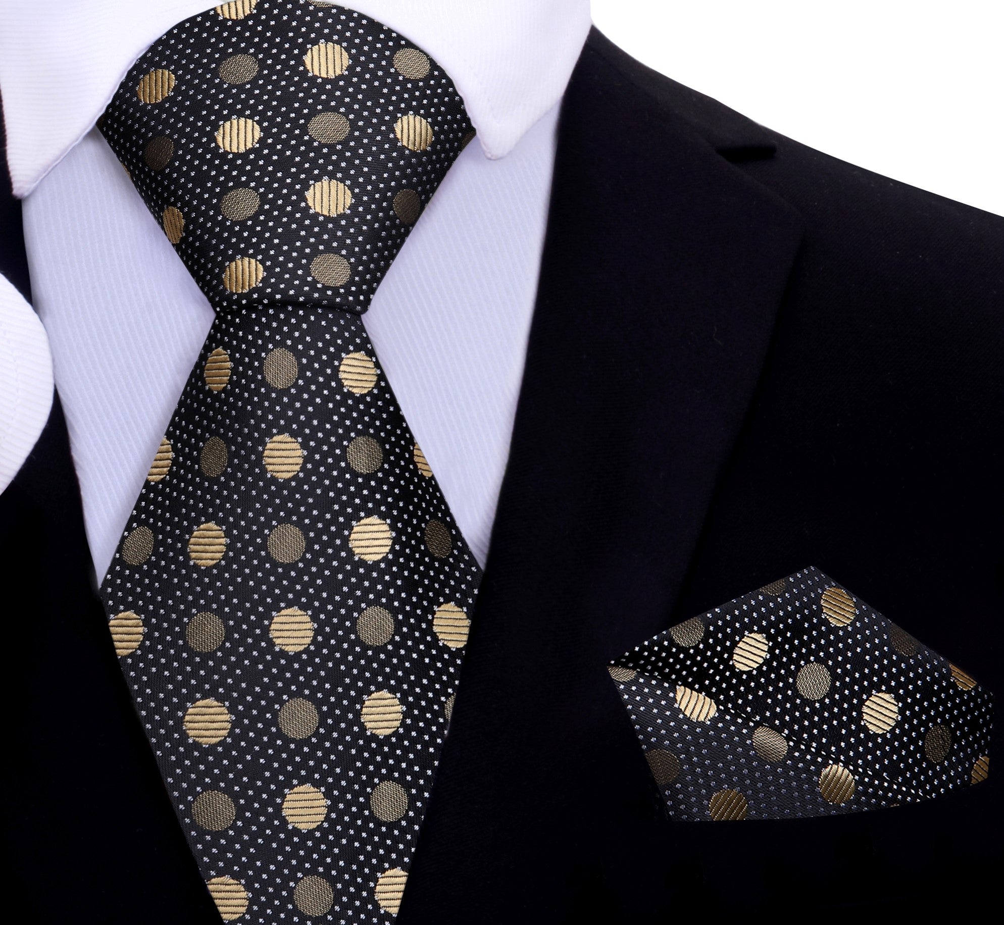 Black polka dot necktie paired with a white dress shirt and charcoal suit for a formal look.