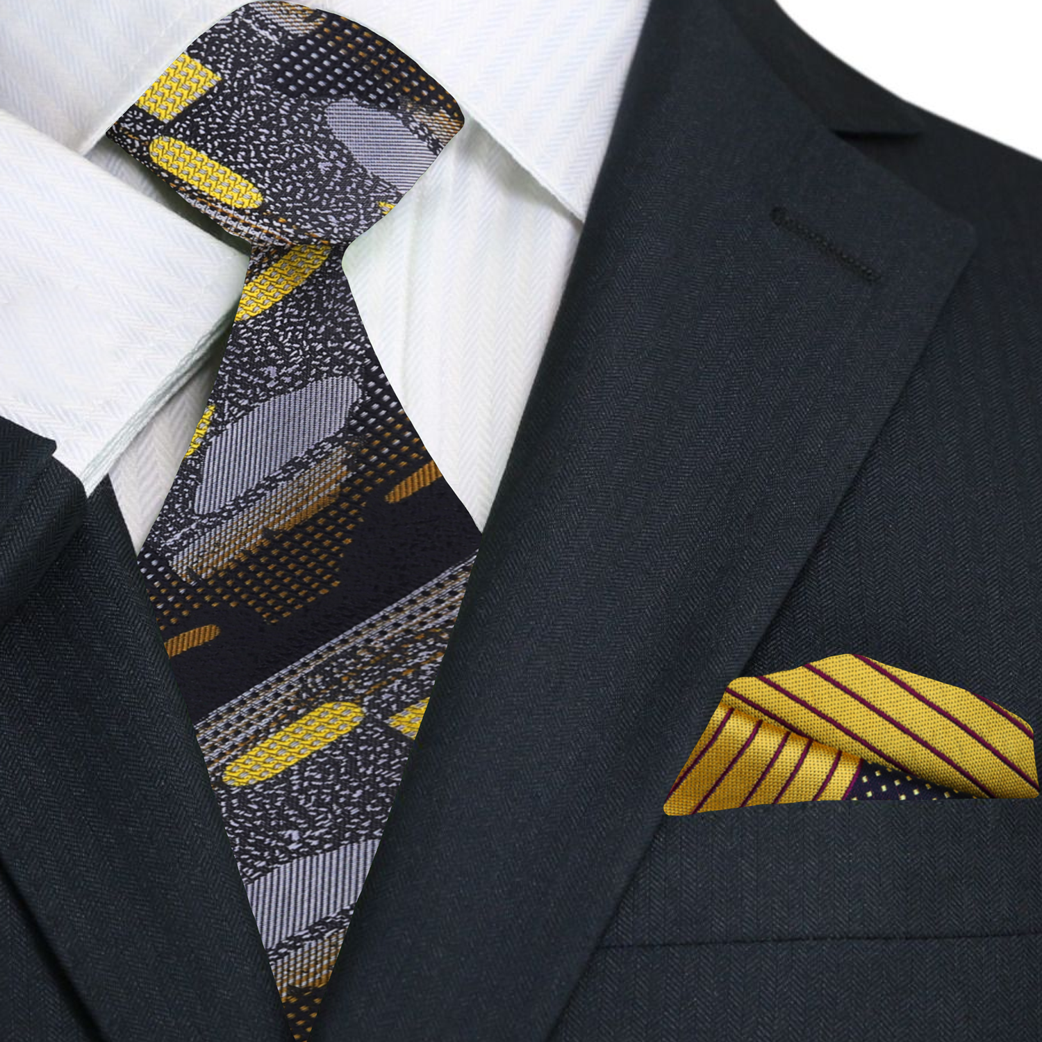 Close-up of the black and gold necktie, highlighting the intricate details of its abstract pattern and silk material.