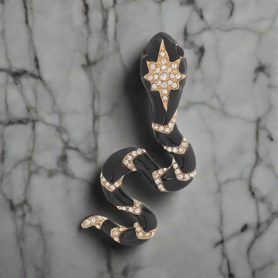 Close-up view of the luxury gemstone snake lapel pin showing vibrant colors and intricate design.