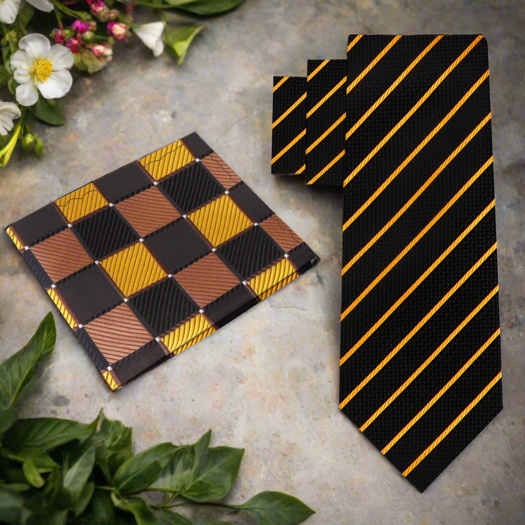 Close-up of black silk tie with gold stripes laying on a charcoal suit