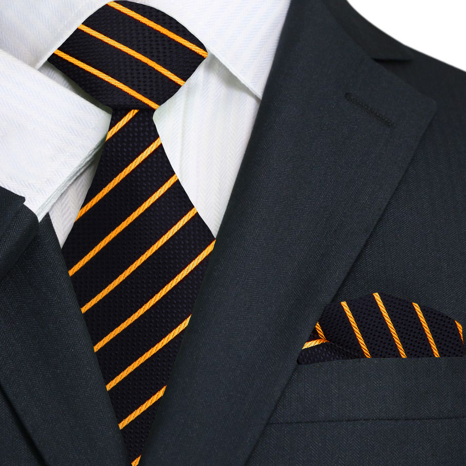 Model wearing black tie with gold accents paired with crisp white shirt and tailored black blazer