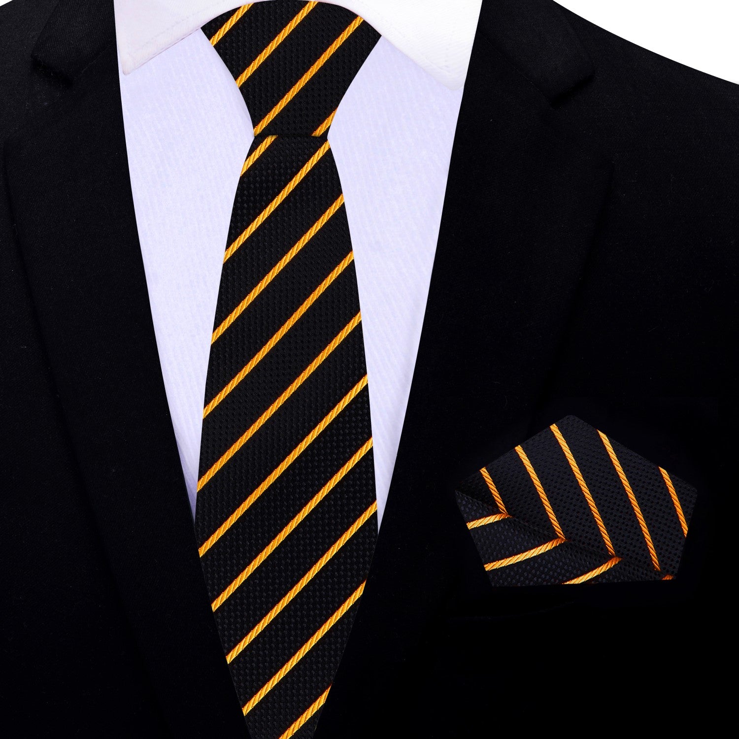 Black silk tie with gold stripe detail displayed beside matching silk pocket square