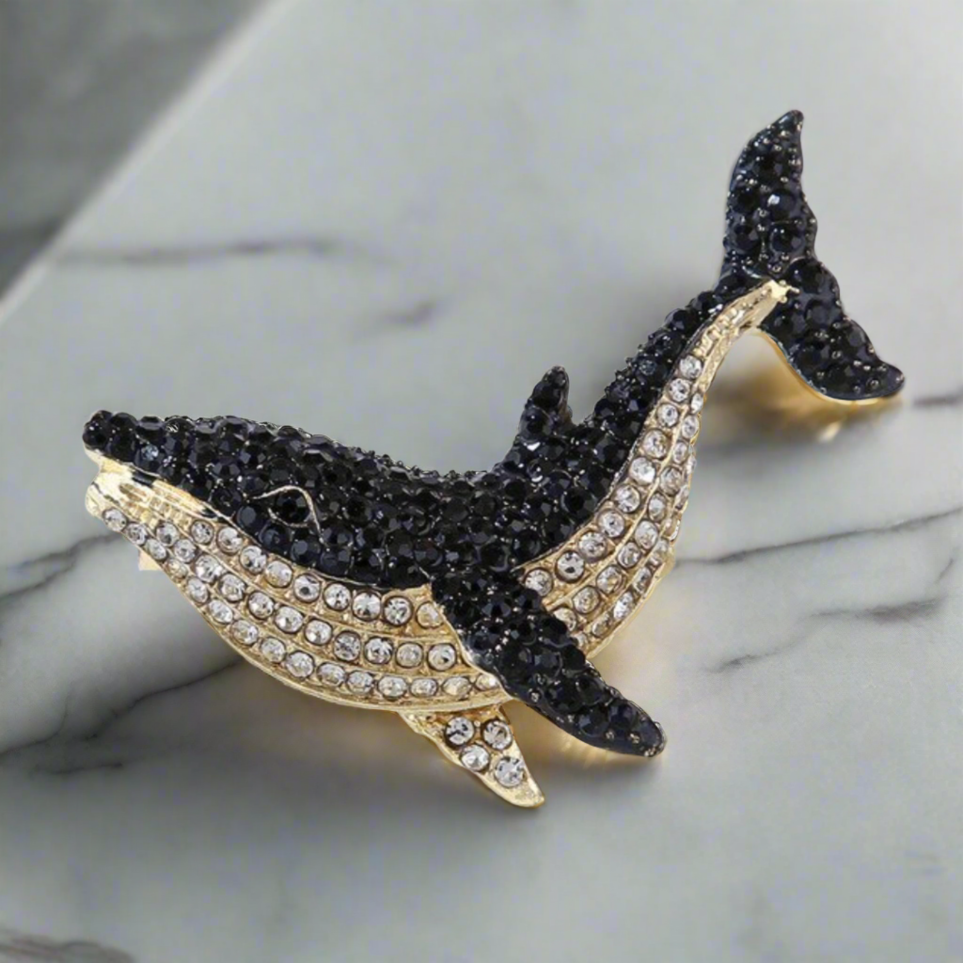 Styled image of a gemstone animal lapel pin attached to a blazer, highlighting its luxurious appearance