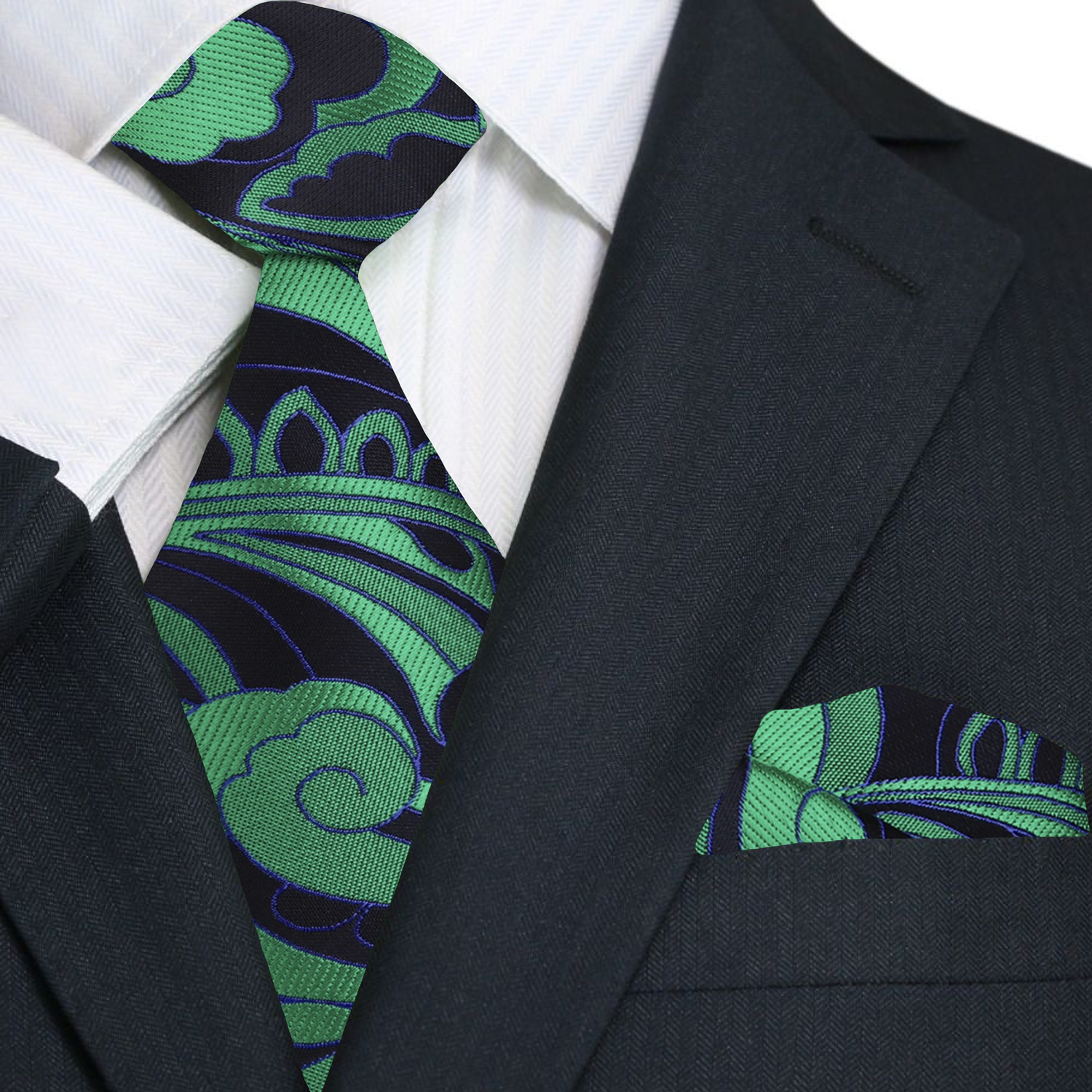 Elegant green paisley silk necktie displayed on a white dress shirt for a classic formal look.