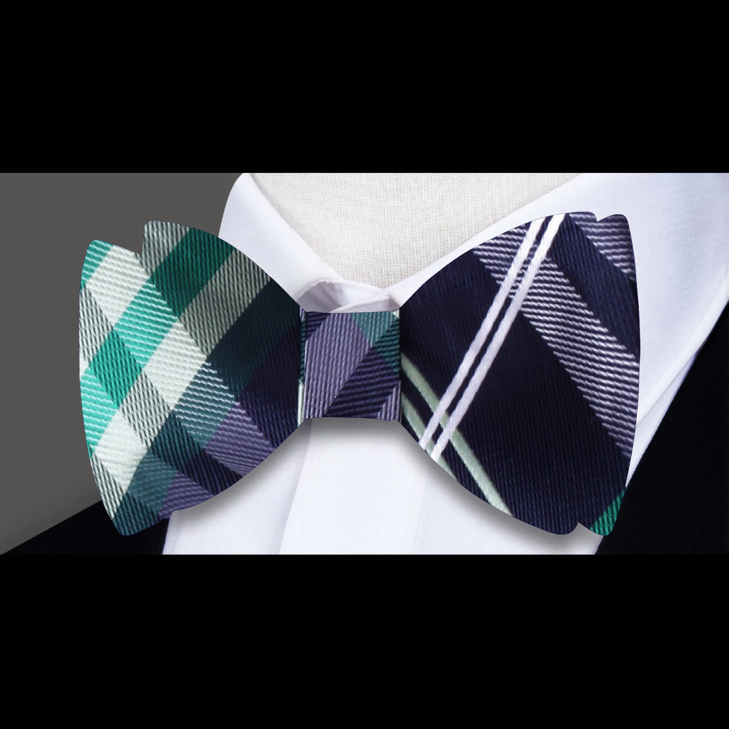Men tying a plaid bow tie in a modern office setting