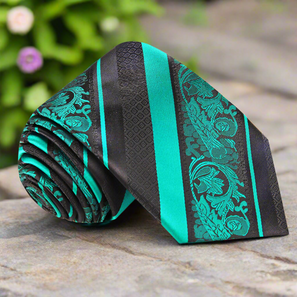 Luxurious green floral silk necktie displayed with matching pocket square for weddings.