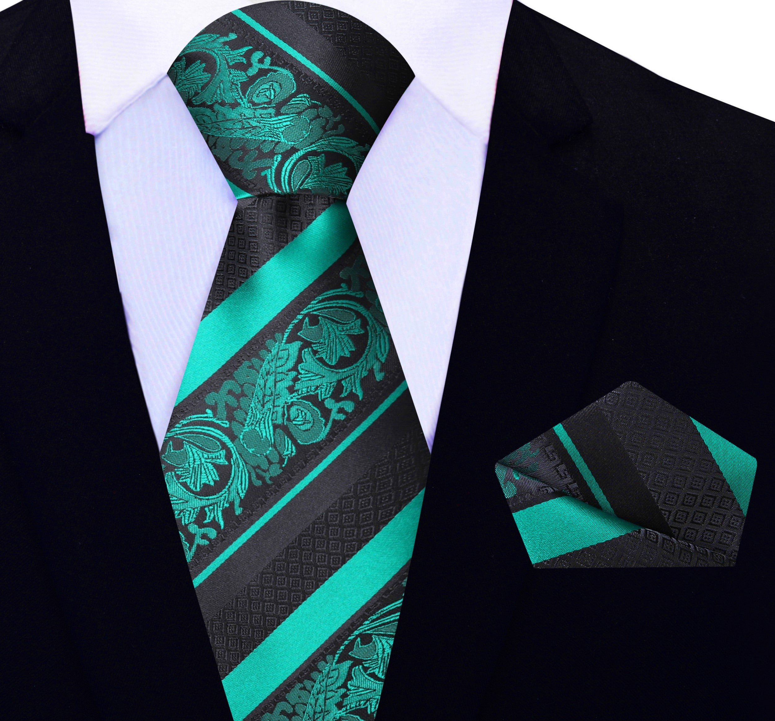 Luxurious green floral silk necktie displayed with matching pocket square for weddings.