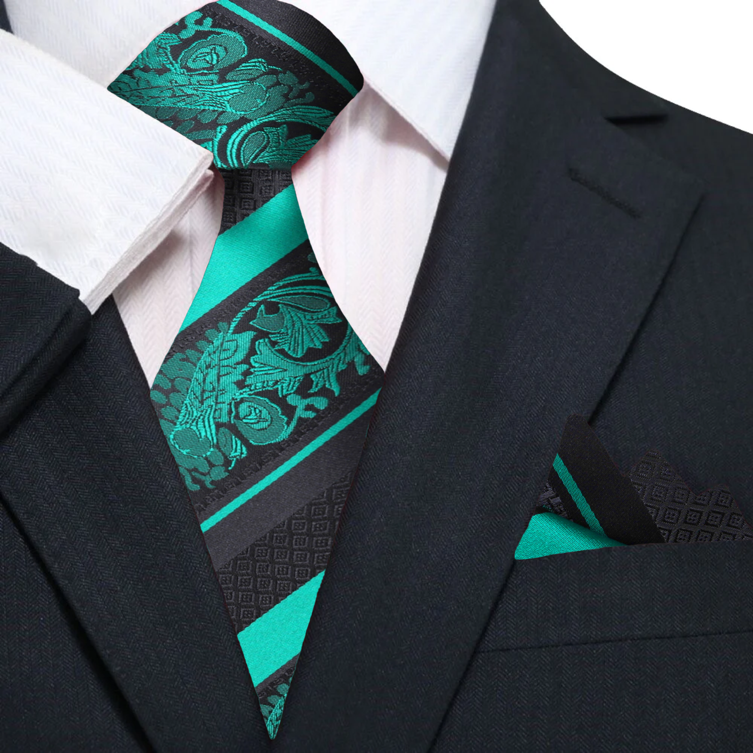 Close-up of the rich green silk necktie showcasing its intricate floral pattern.