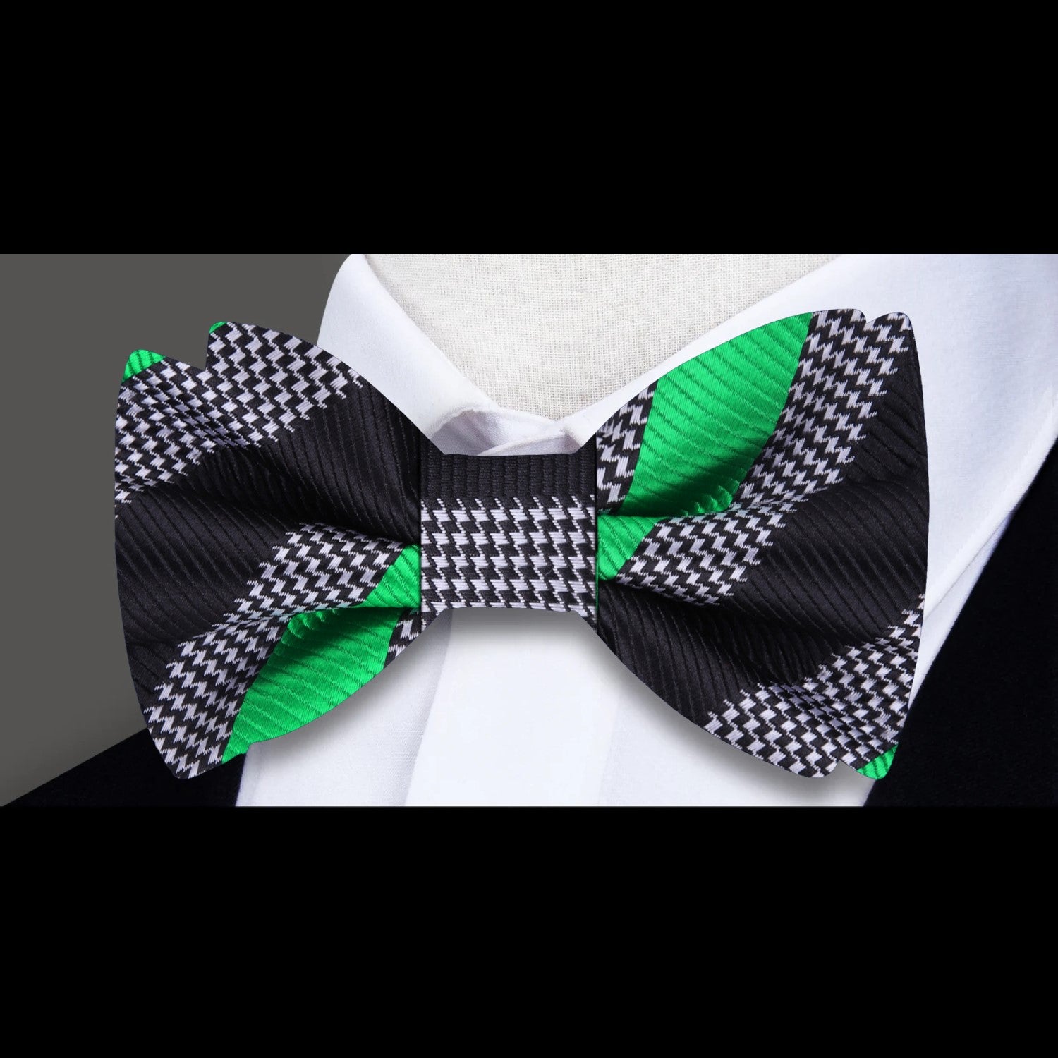Close-up of the green and white striped silk bow tie showcasing its texture