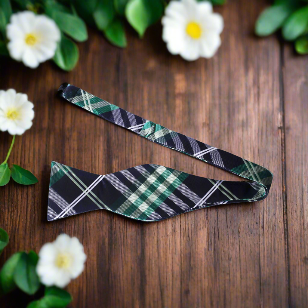 Group of friends wearing plaid bow ties at a casual wedding reception