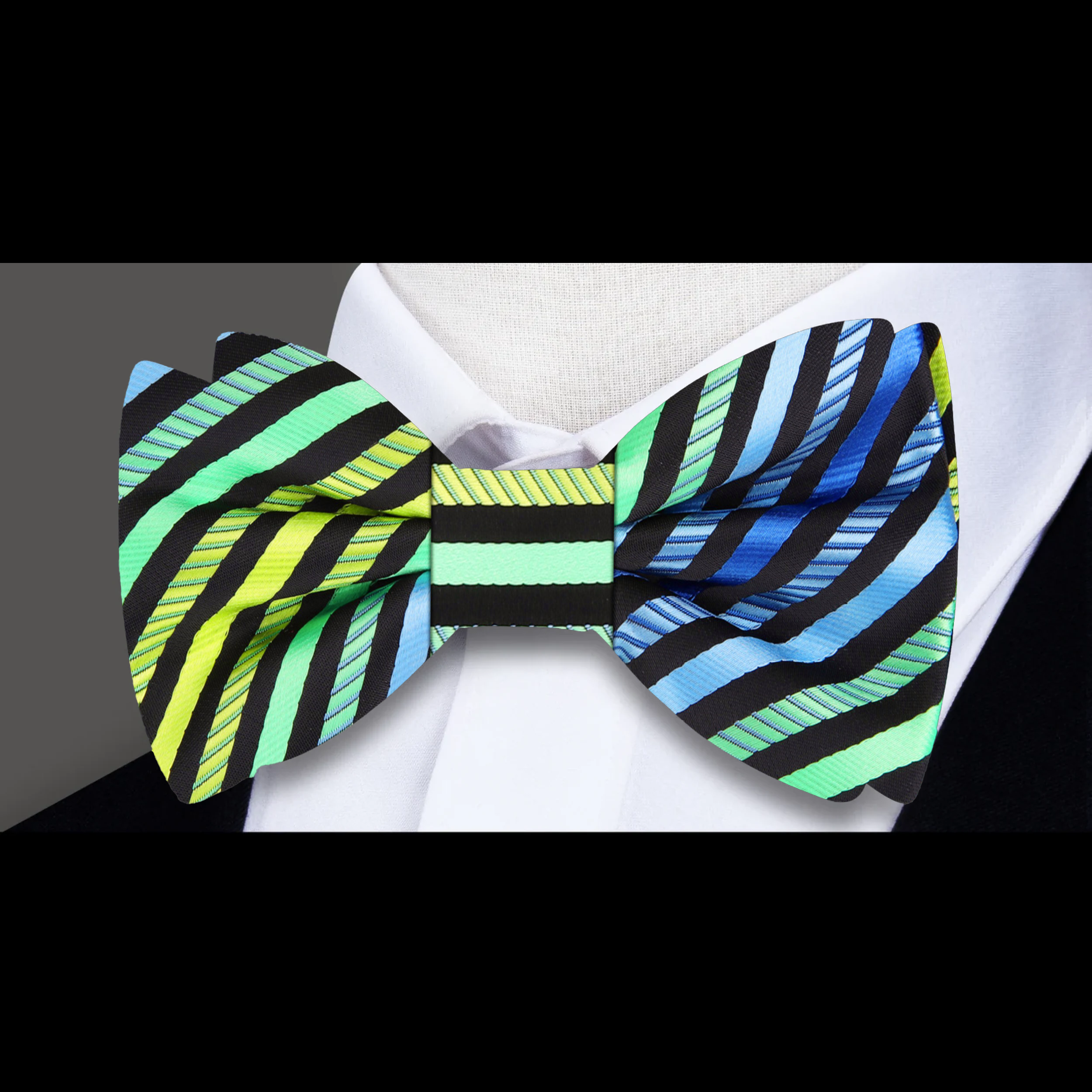 Man wearing stylish bow tie with suit at formal event