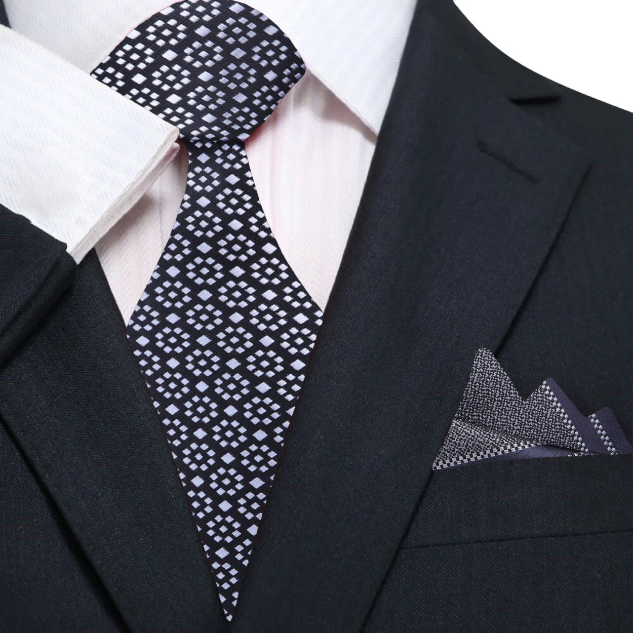 Man wearing geometric silk tie with a white dress shirt for business attire