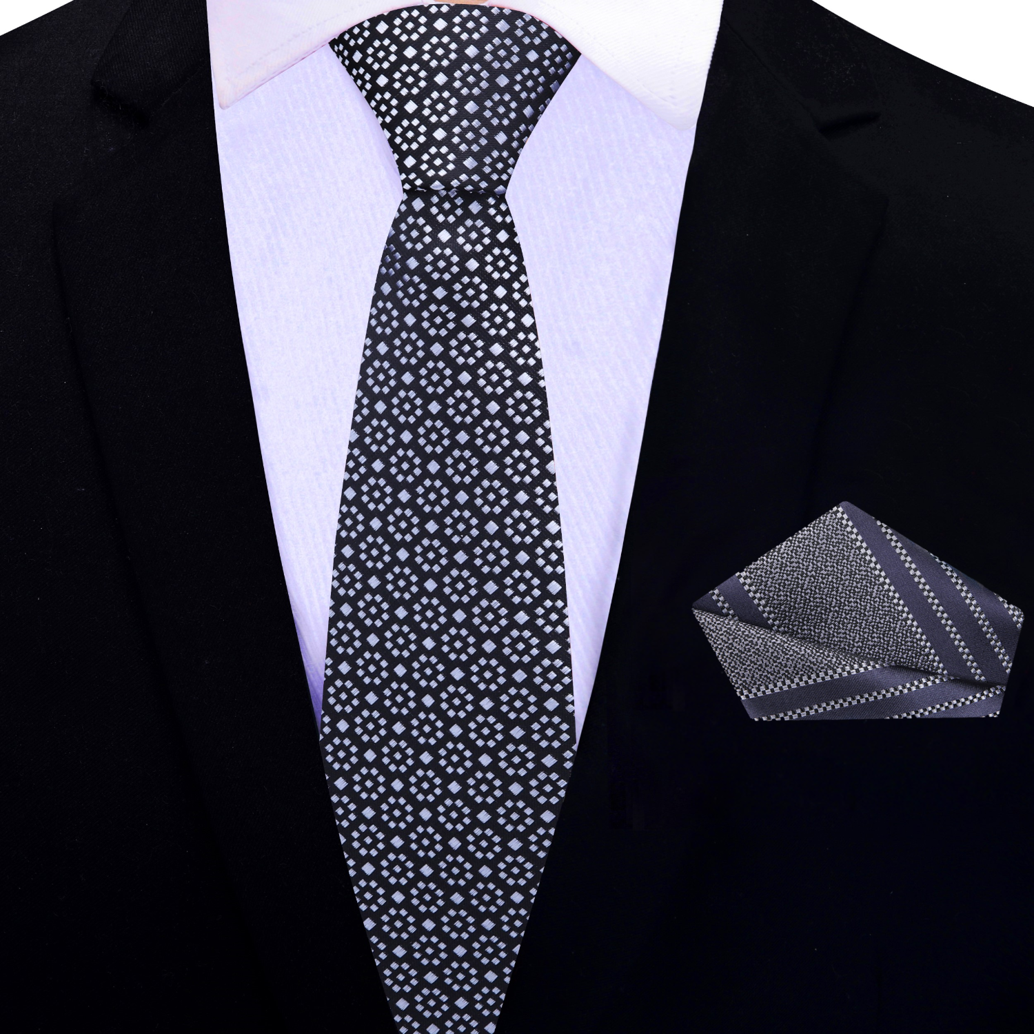 Elegant black and grey mens necktie paired with a navy suit for formal event