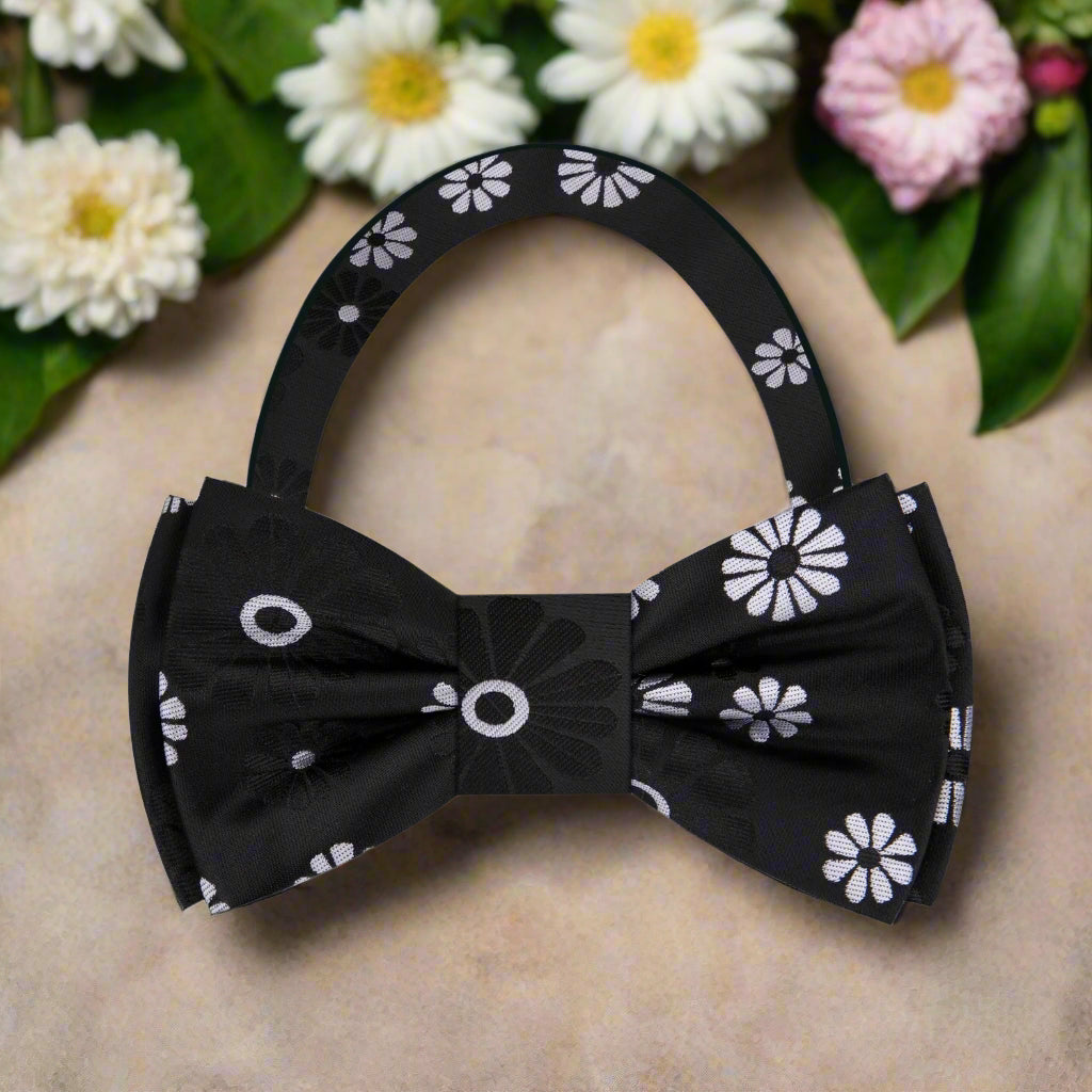 Man wearing a silk bow tie with floral design at a formal dinner