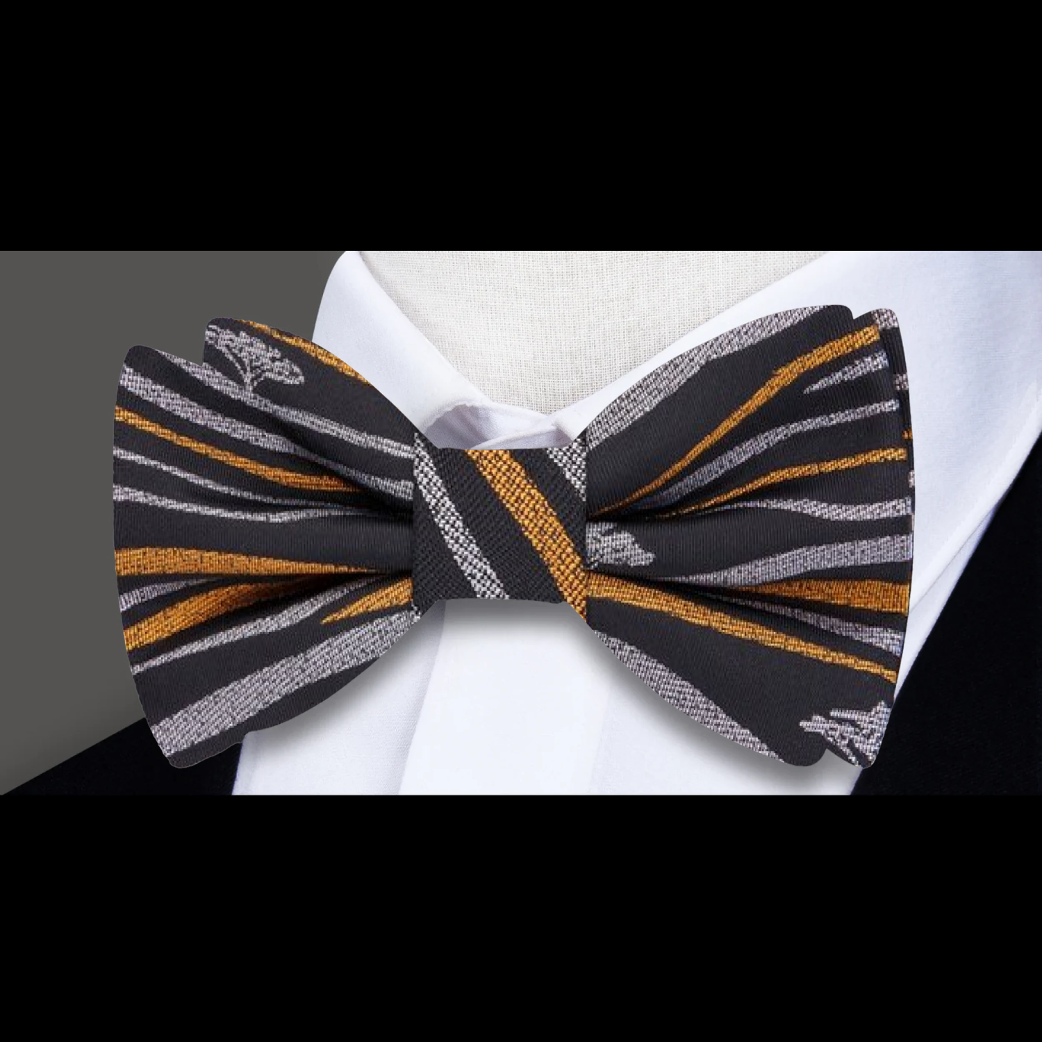 Men wearing a pre-tied silk bow tie in black at a wedding
