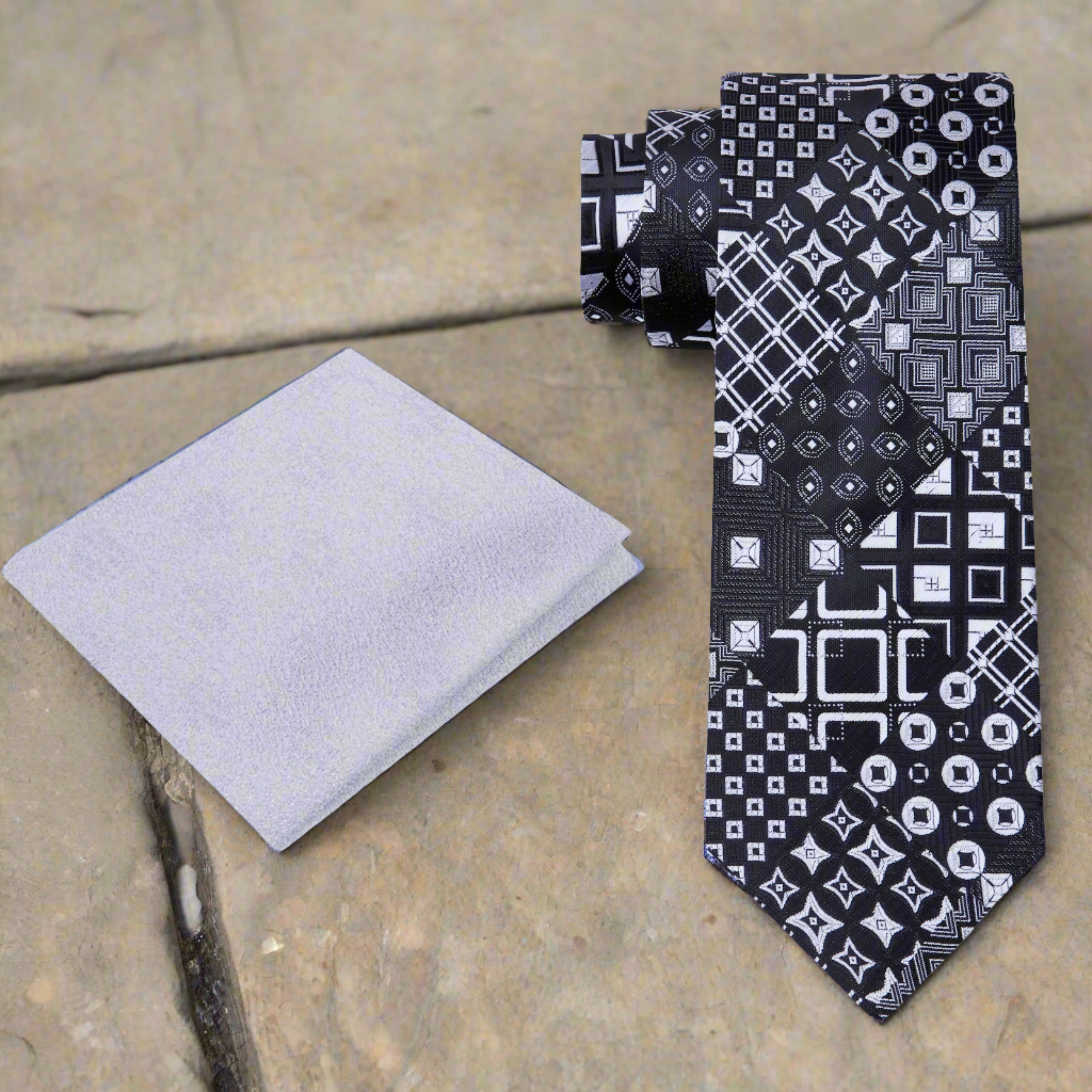 Men wearing the abstract pattern dress tie with a white shirt and black suit
