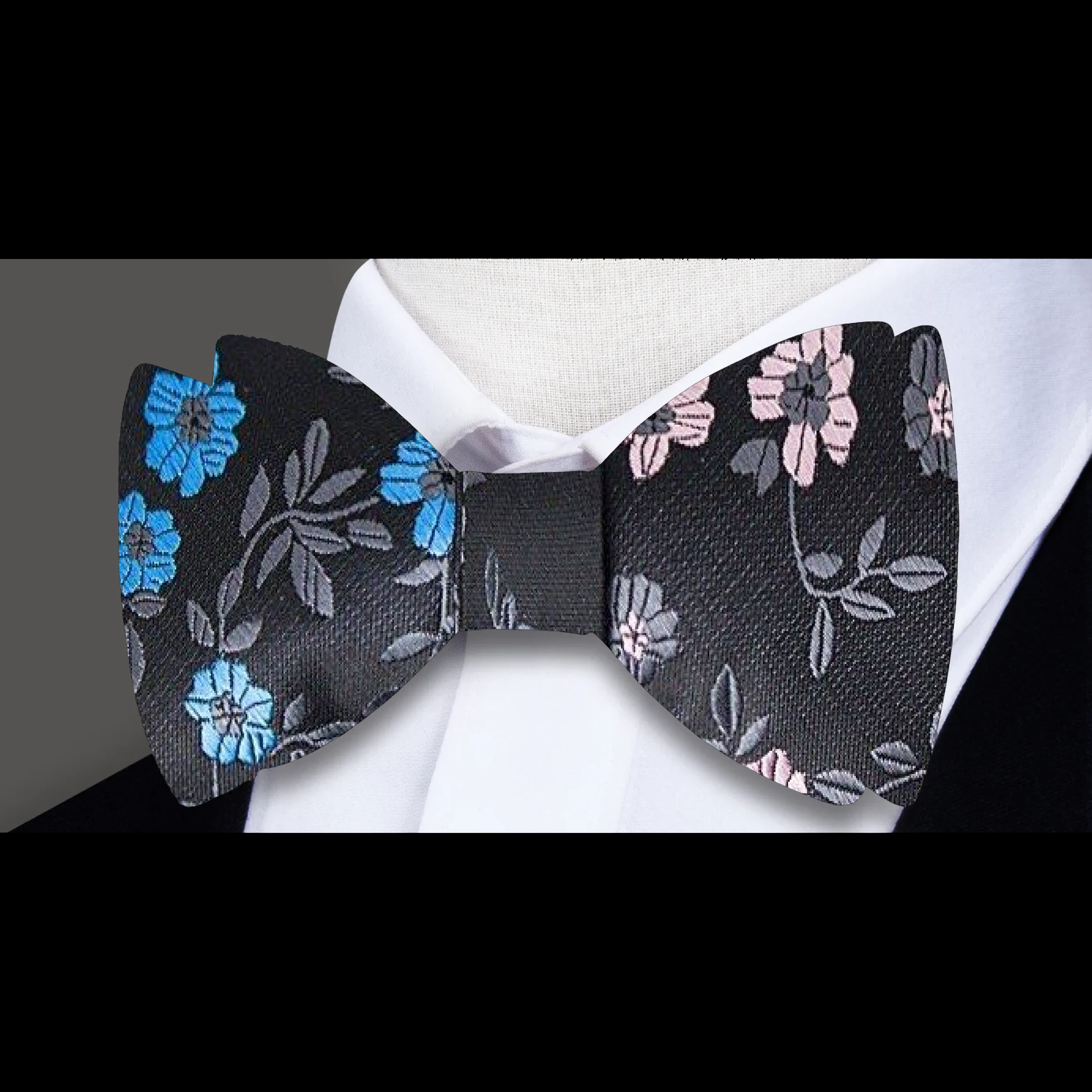 Light silver floral bow tie with delicate pink and blue accents, ideal for spring events.