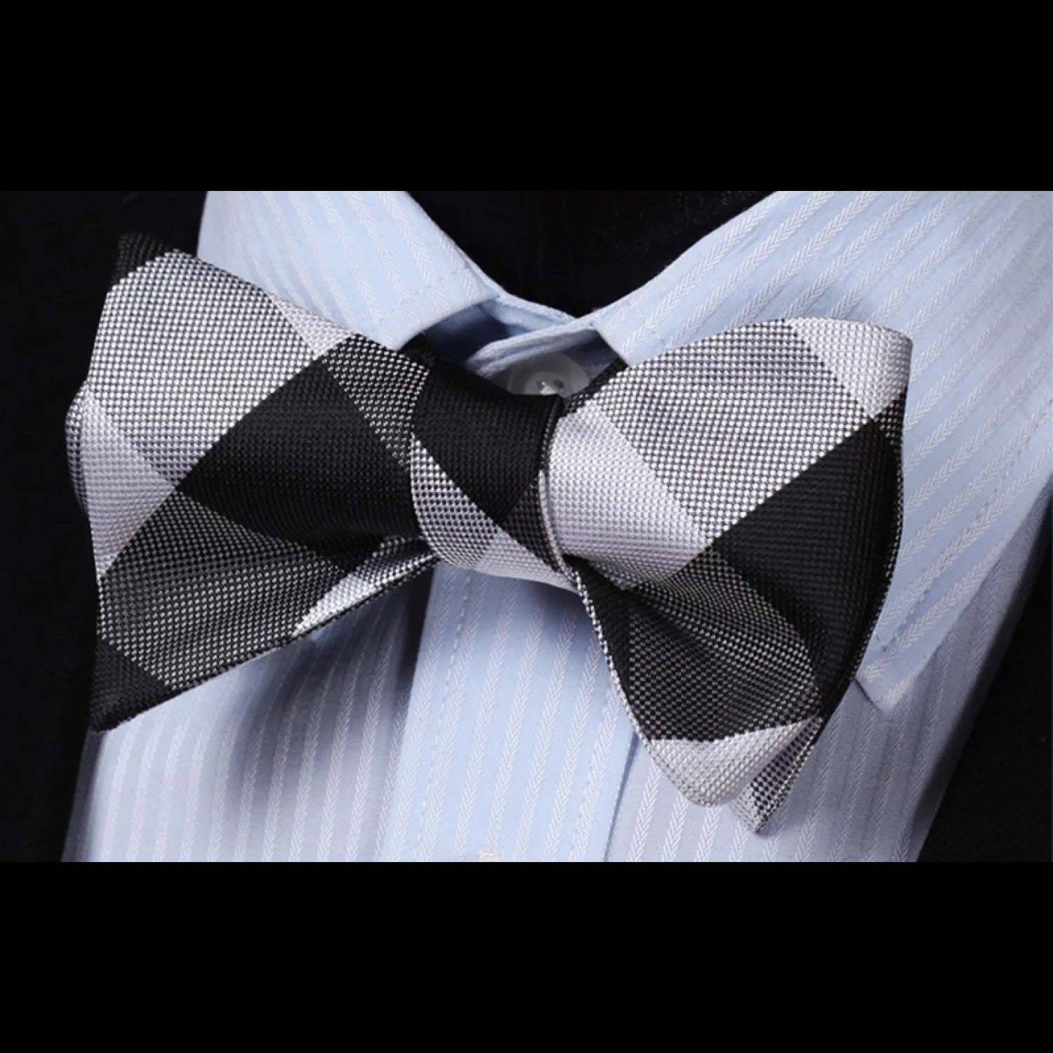Fashionable man wearing a plaid bow tie with a shirt and blazer, ideal for evening outings