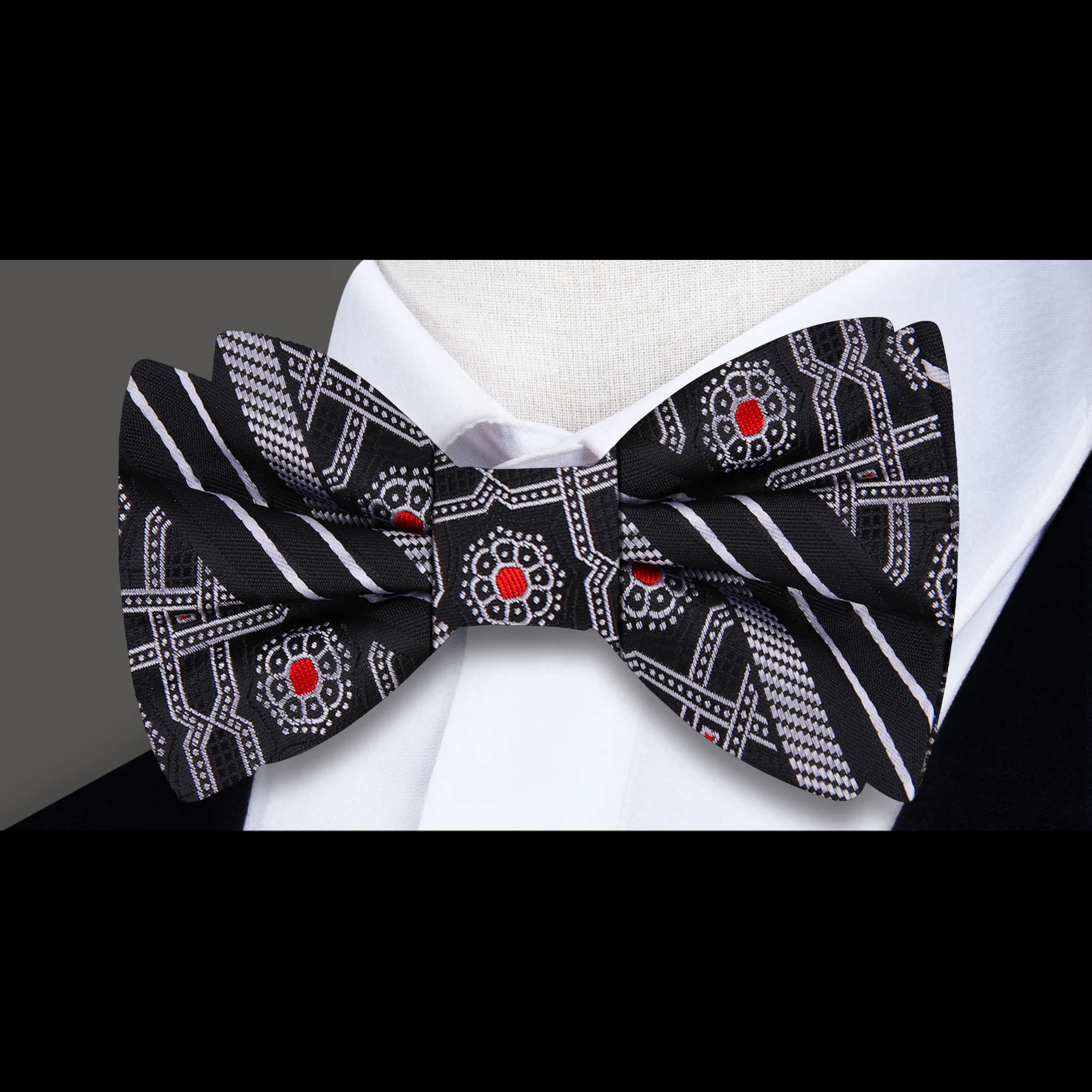 Front view of the silk geometric abstract bow tie in black and red for formal events