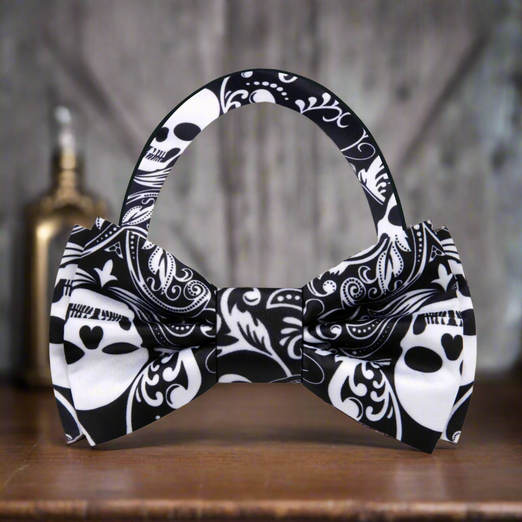 Model wearing black skull bow tie with formal white shirt at gothic party