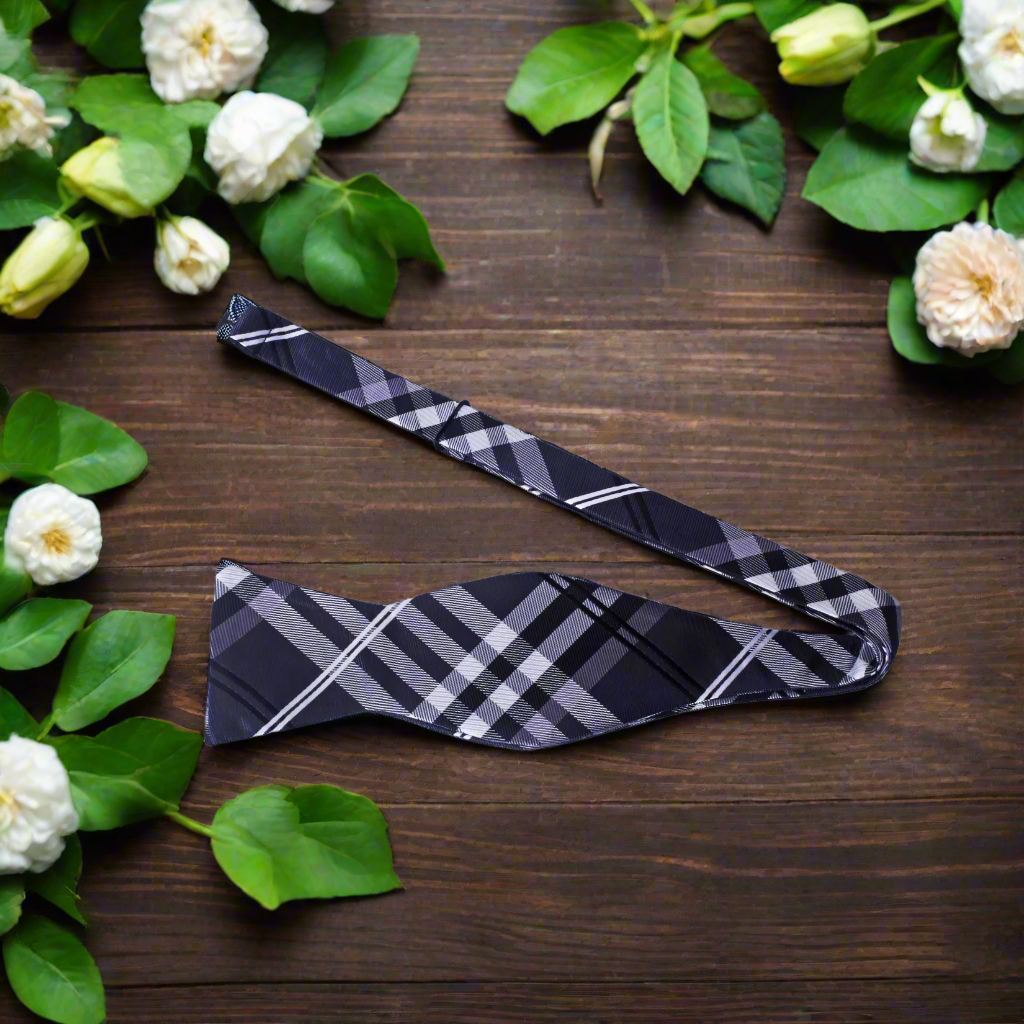 Group of friends wearing plaid bow ties at a casual wedding reception