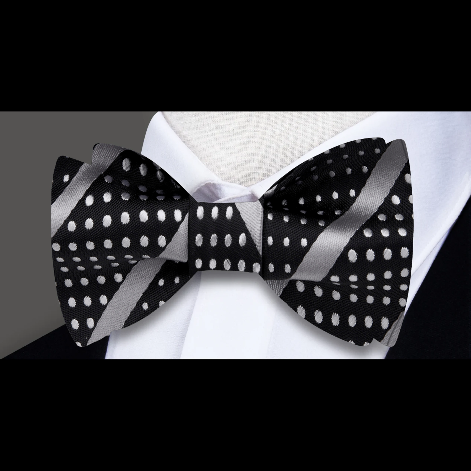 Chic striped polka dot bow tie in vibrant colors, styled with a white dress shirt.
