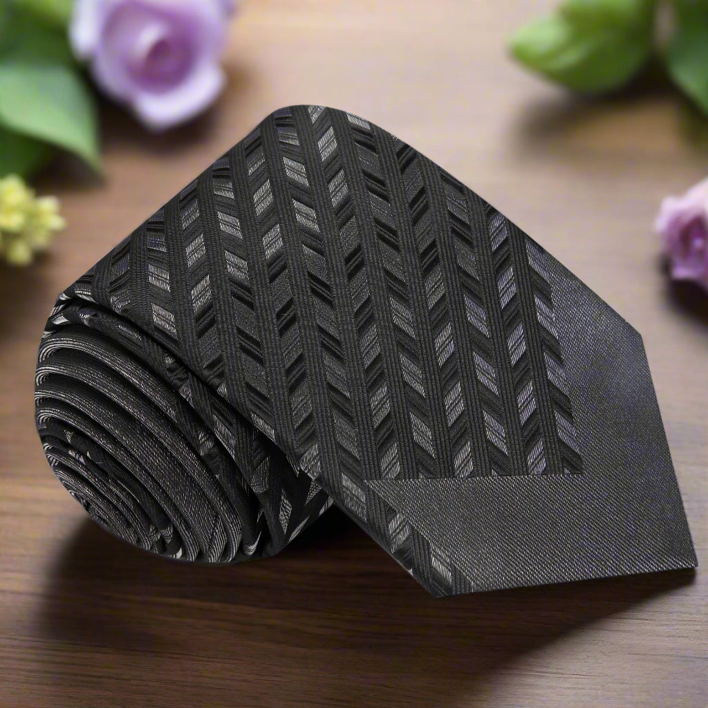 Close-up of black and grey herringbone silk tie highlighting the pattern and texture
