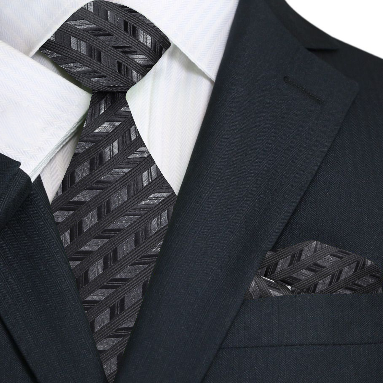 Close-up of black and grey herringbone silk tie highlighting the pattern and texture