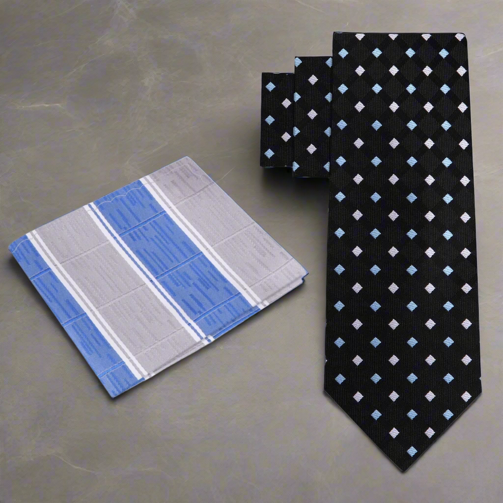 Man wearing geometric silk necktie with light blue shirt and navy suit