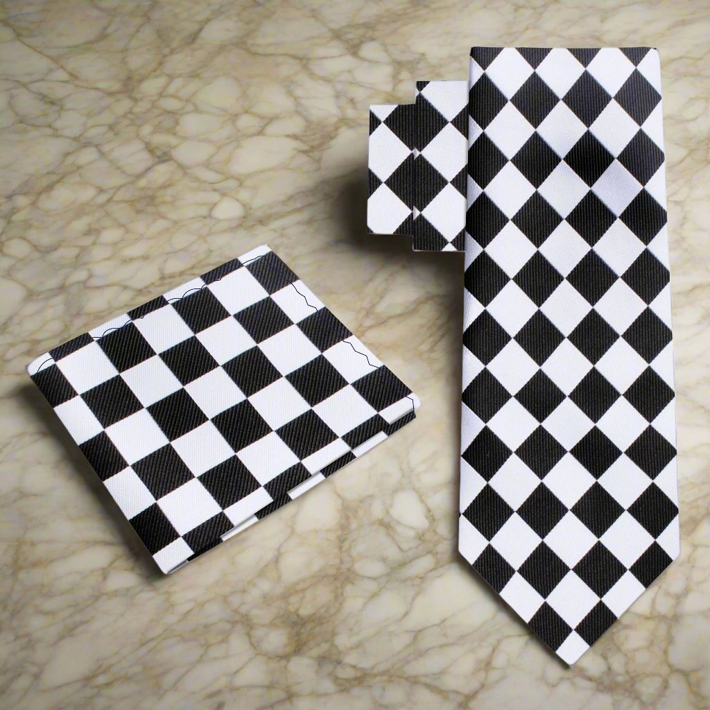 Full view of the elegant necktie paired with a white dress shirt and charcoal suit.